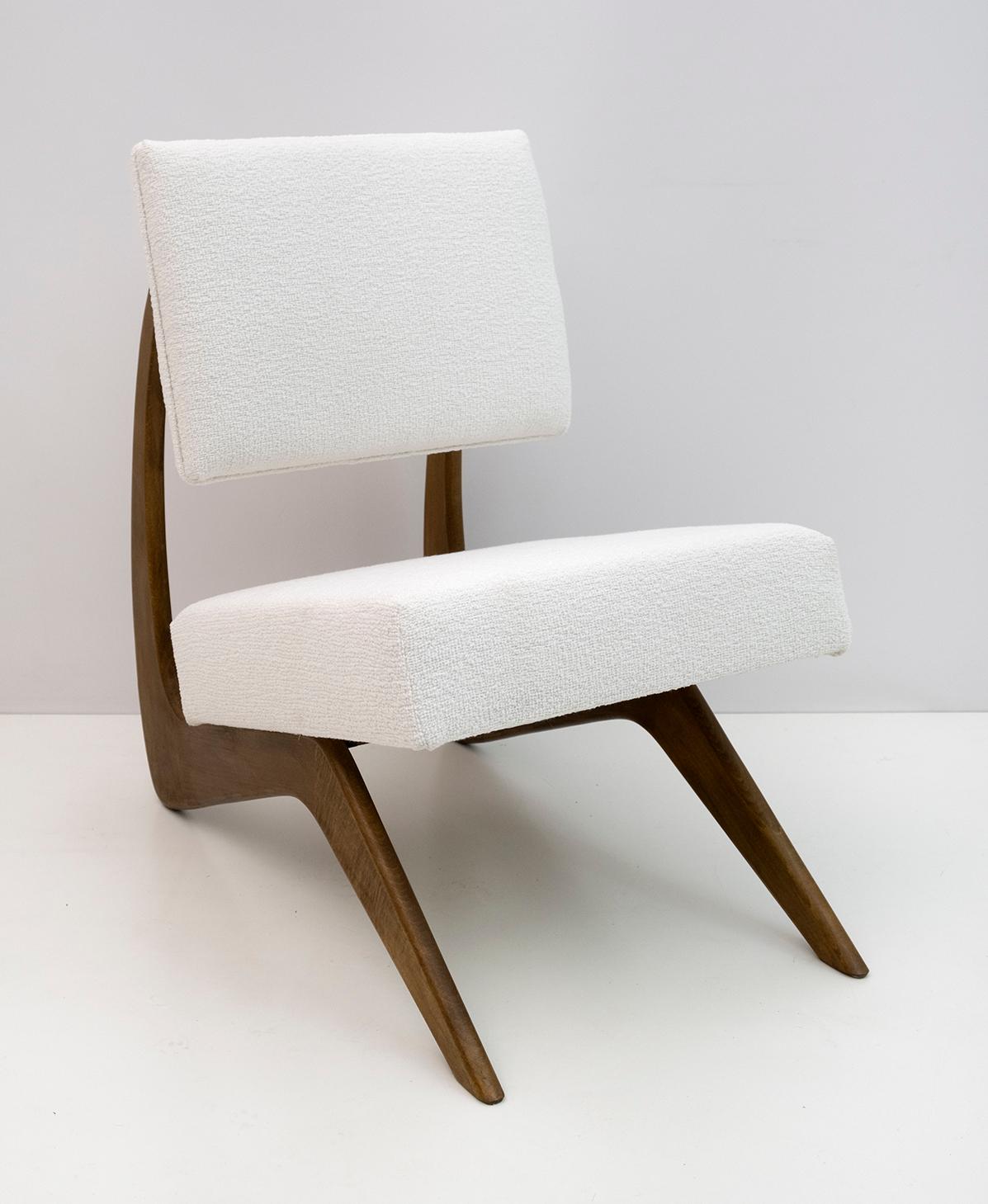 Armchair designed by the American designer Adrian Pearsall. The frame of this cocktail lounge chair is made of walnut wood in a beautiful curved shape and upholstered in white chenille fabric. The armchair has been restored and reupholstered.