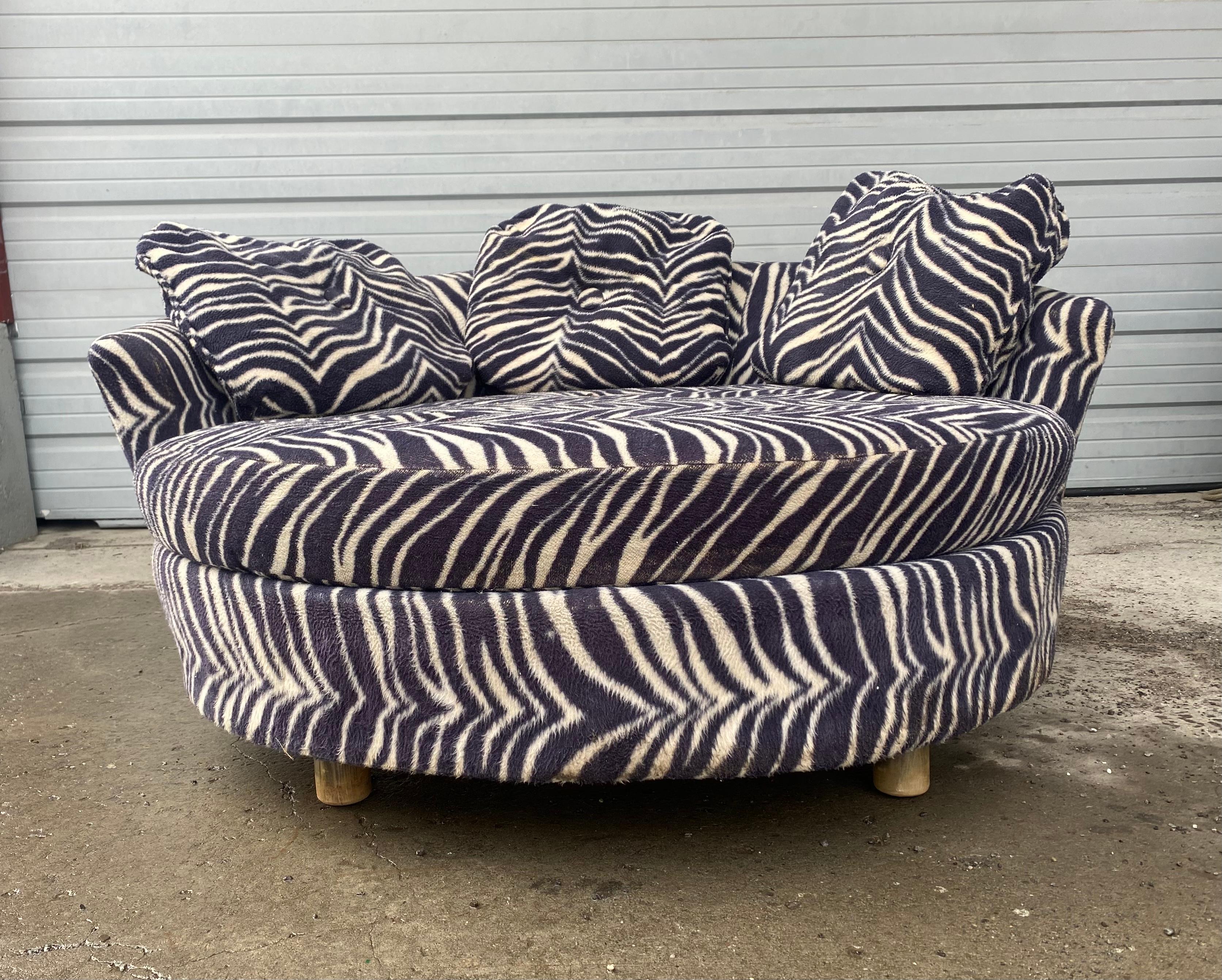 Super stylized sphere, round lounge chair, chaise lounge, in the manner of Adrian Pearsall and Milo Baughman, Retains its original faux zebra fabric in useable condition, in need of a good cleaning, large round seat cushion, missing button and small