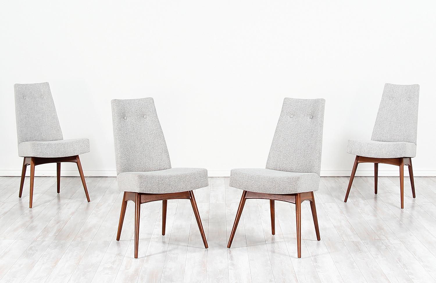 Set of four modern dining chairs model 1613-C designed by Adrian Pearsall for Craft Associates in the United States circa 1960s. This incredible set of model 1613-C dining chairs feature a sturdy walnut wood frame with new high-density foam and