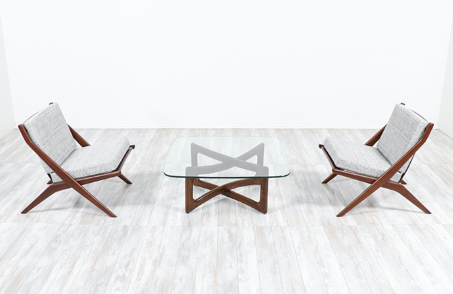 Elegant modern coffee table designed by Adrian Pearsall in the United States for Craft Associates circa 1960s. Like many of Pearsall’s designs, the model 2452-T36 features a fun and unique structure with a sculpted walnut wood base and a new custom