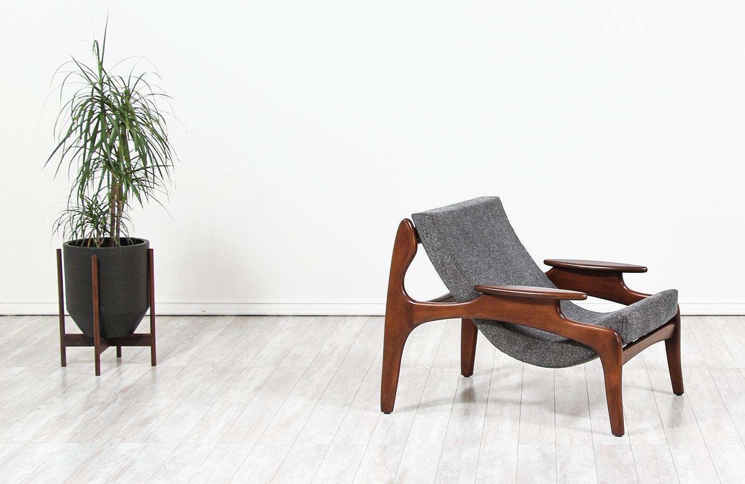 Mid-Century Modern sling chair designed by Adrian Pearsall for craft associates in the United States, circa 1960s. This iconic and rare to find model 804-C chair features a solid walnut wood frame with new rubber Pirelli webbing that supports the