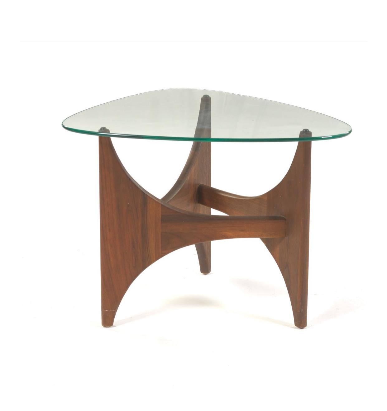 An iconic side table from Adrian Pearsall for Craft Associates. Oiled walnut base with good, well defined wood grain. Triangular shaped glass top is in good condition. 