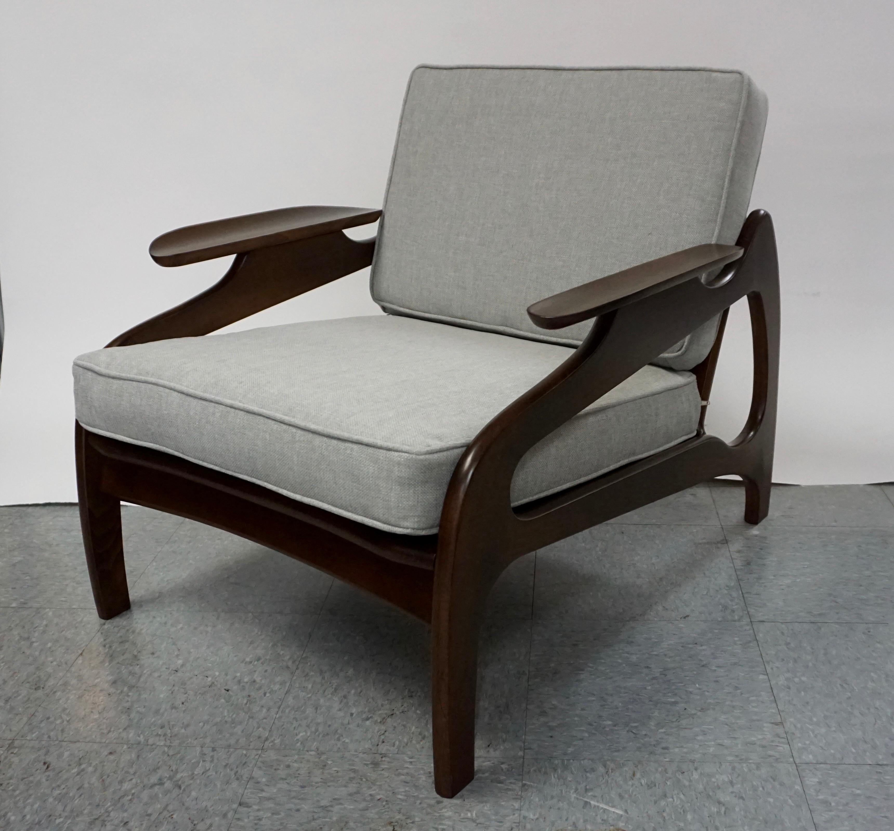 Pair of Adrian Pearsall lounge chairs in dark walnut finish. They have been restored with new upholstery and foam, as well as new Pirelli rubber strapping. Fabric is a light grey with white highlights. Woven backs are in great condition.