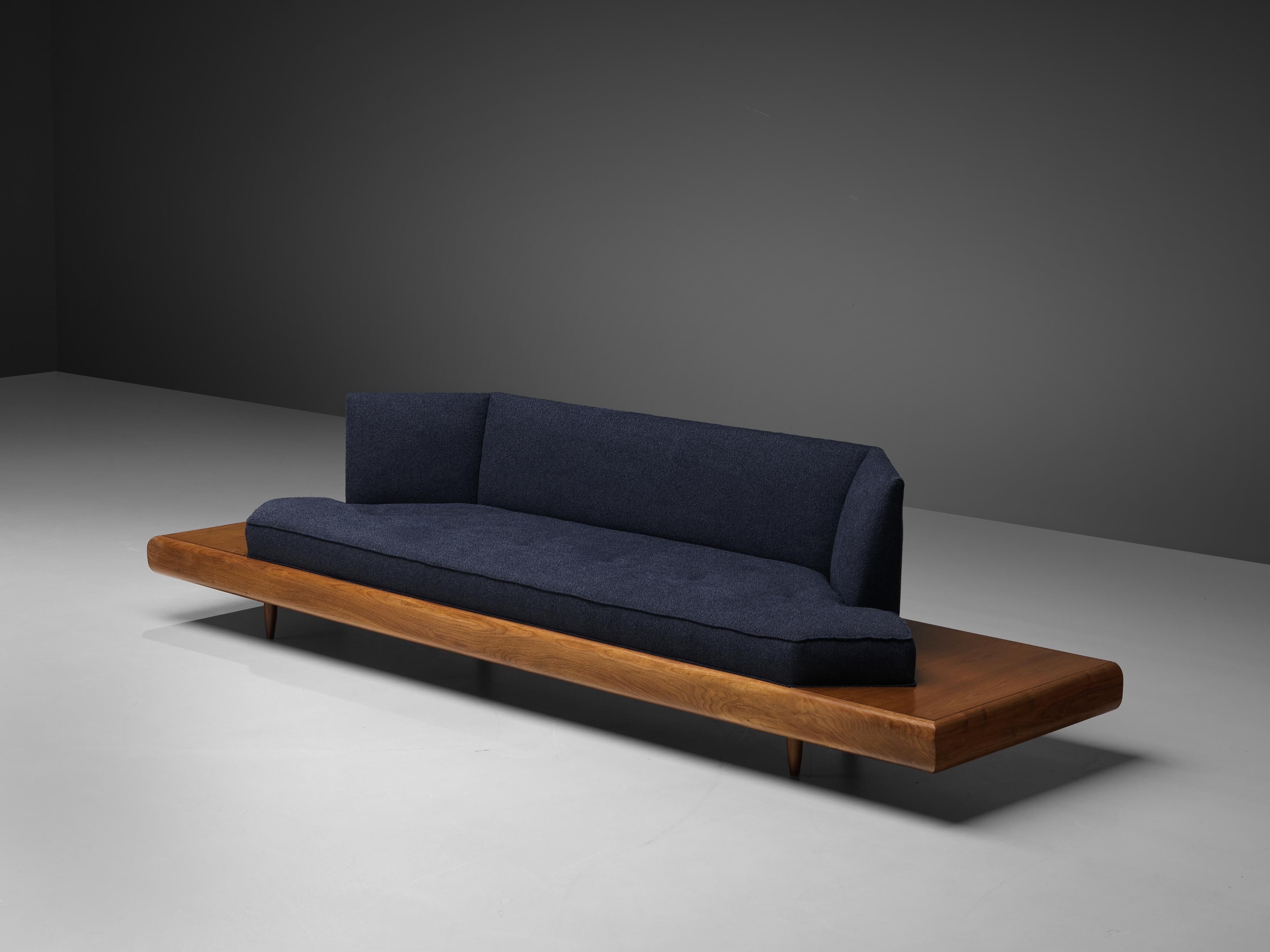Adrian Pearsall, sofa model '2006S', blue fabric, walnut, United States, 1960s.

Classic, soft shaped sofa has a unique feel and although it is modest and simplistic it also shows soft, delicate lines and shapes. The walnut frame that extends past
