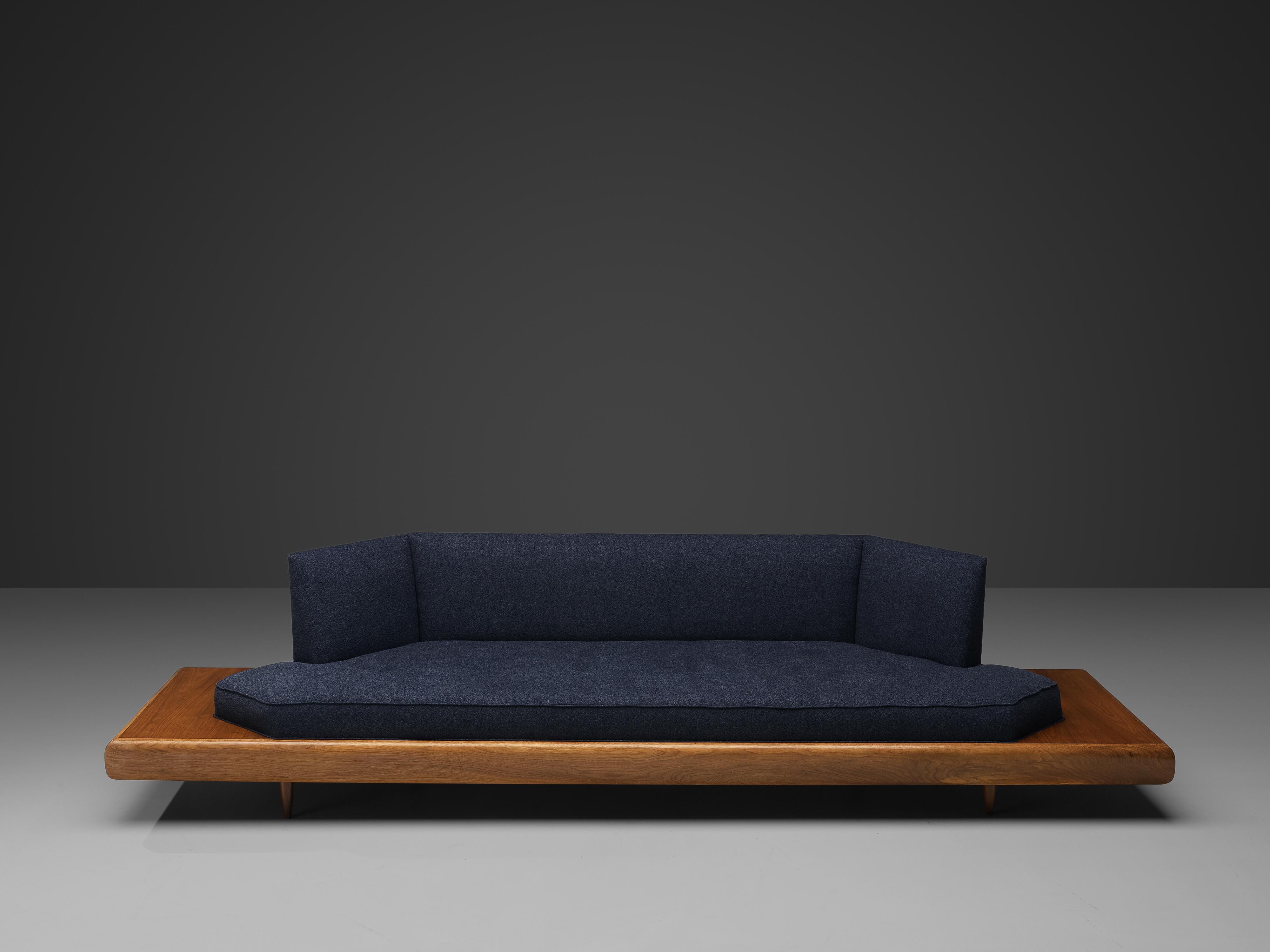 Adrian Pearsall, sofa model '2006S', fabric, walnut, United States, 1960s.

Classic, soft shaped sofa has a unique feel and although it is modest and simplistic it also shows soft, delicate lines and shapes. The walnut frame extends past the