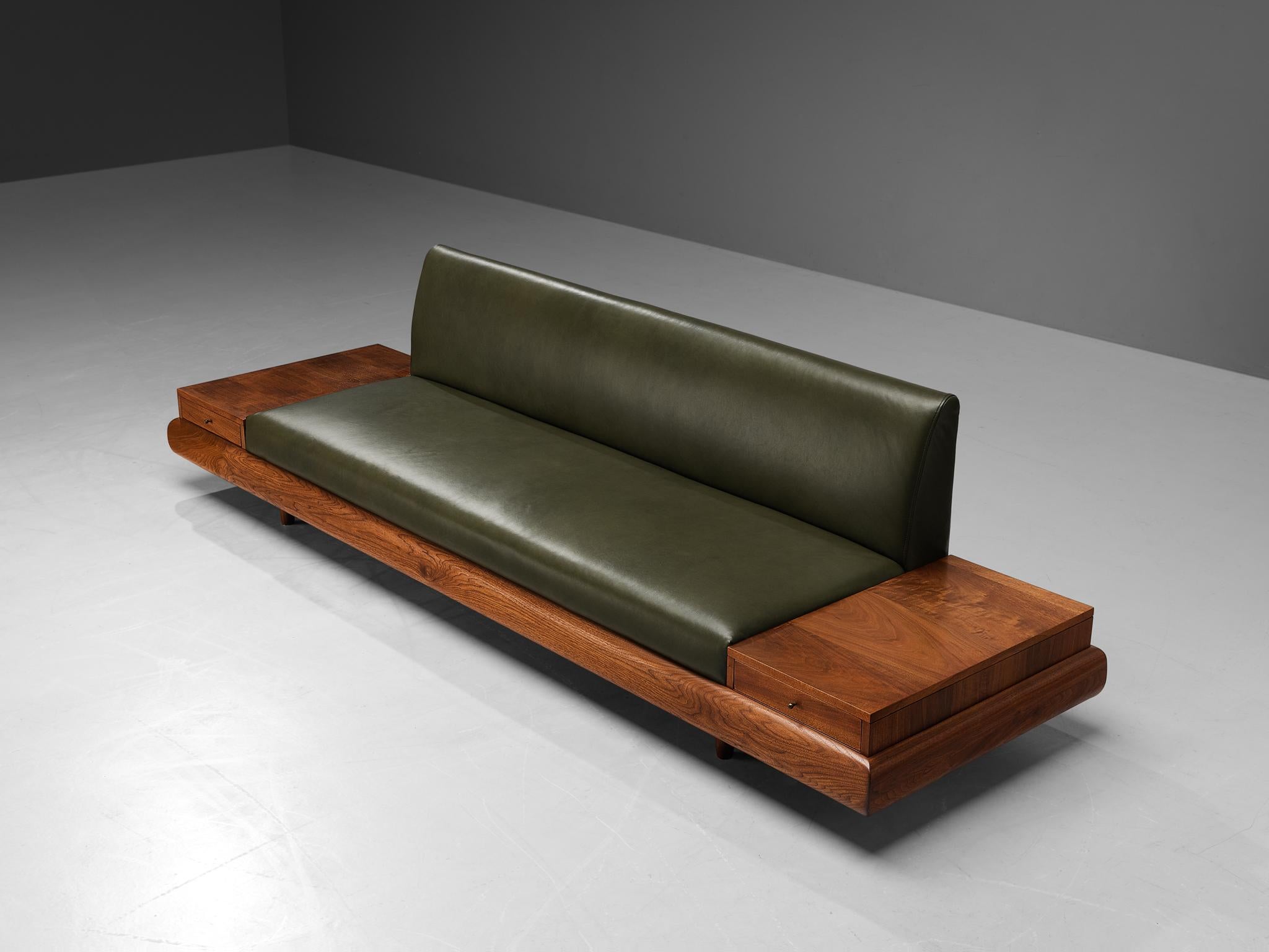 Adrian Pearsall, 'Platform' sofa with two drawers, model 1709-S, leather upholstery, walnut, United States, 1960s

Adrian Pearsall is known for his rather unique sofa designs. The '1709-S' is no exception. On a low base of a thick walnut frame