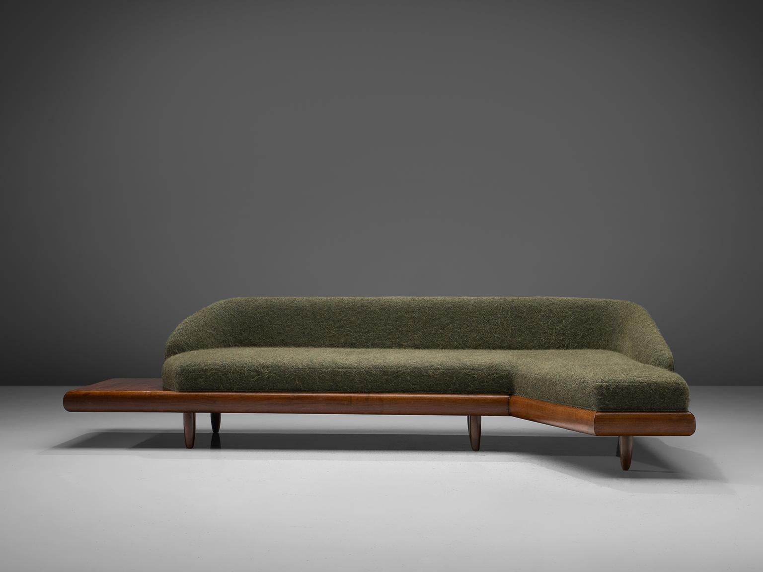 Adrian Pearsall, 'Boomerang' sofa, in green Pierre Frey fabric and walnut, United States, 1960s

This boomerang sofa has a unique shape with sinuous lines which create a monumental and inviting look. The backrest holds sloping armrests and a high,