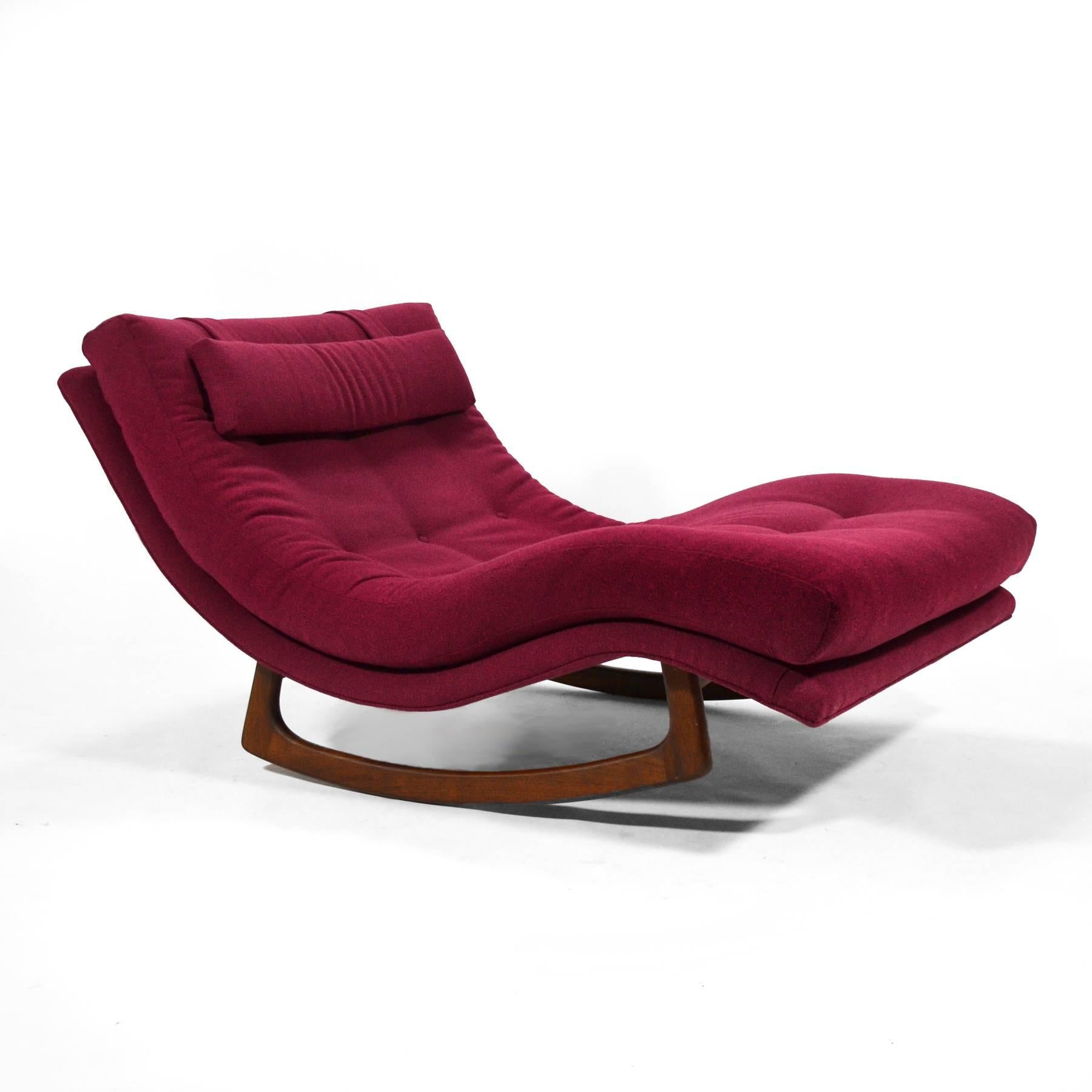 A large and incredibly comfortable chaise with a sculptural walnut base that allows it to rock gently, this design by Adrian Pearsall can be either a statement piece in a living room, or a relaxing seat in a master suite.