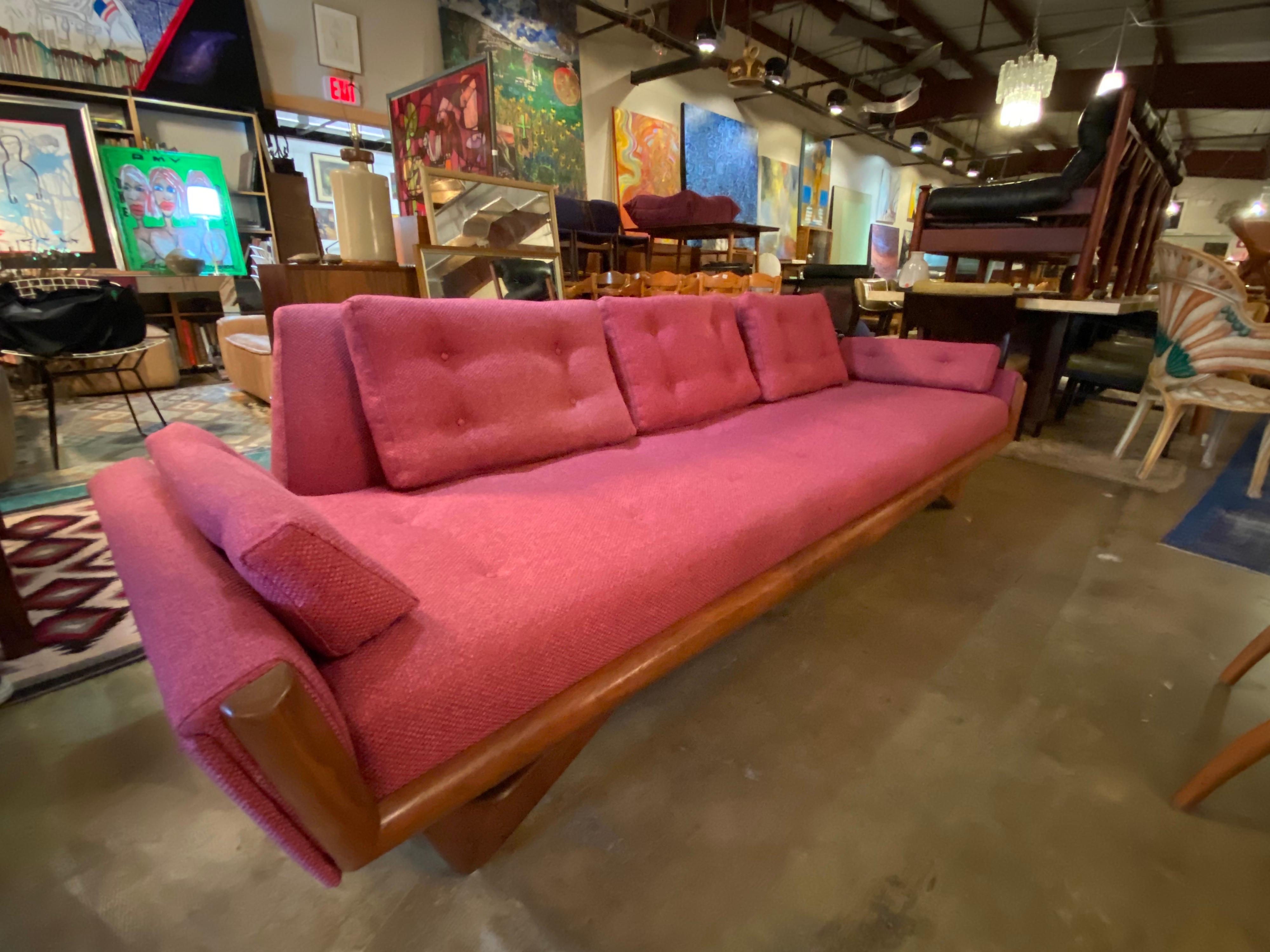 Mid-Century Modern Gondola sofa by Adrian Pearsall in walnut has been reupholstered and in great vintage condition.