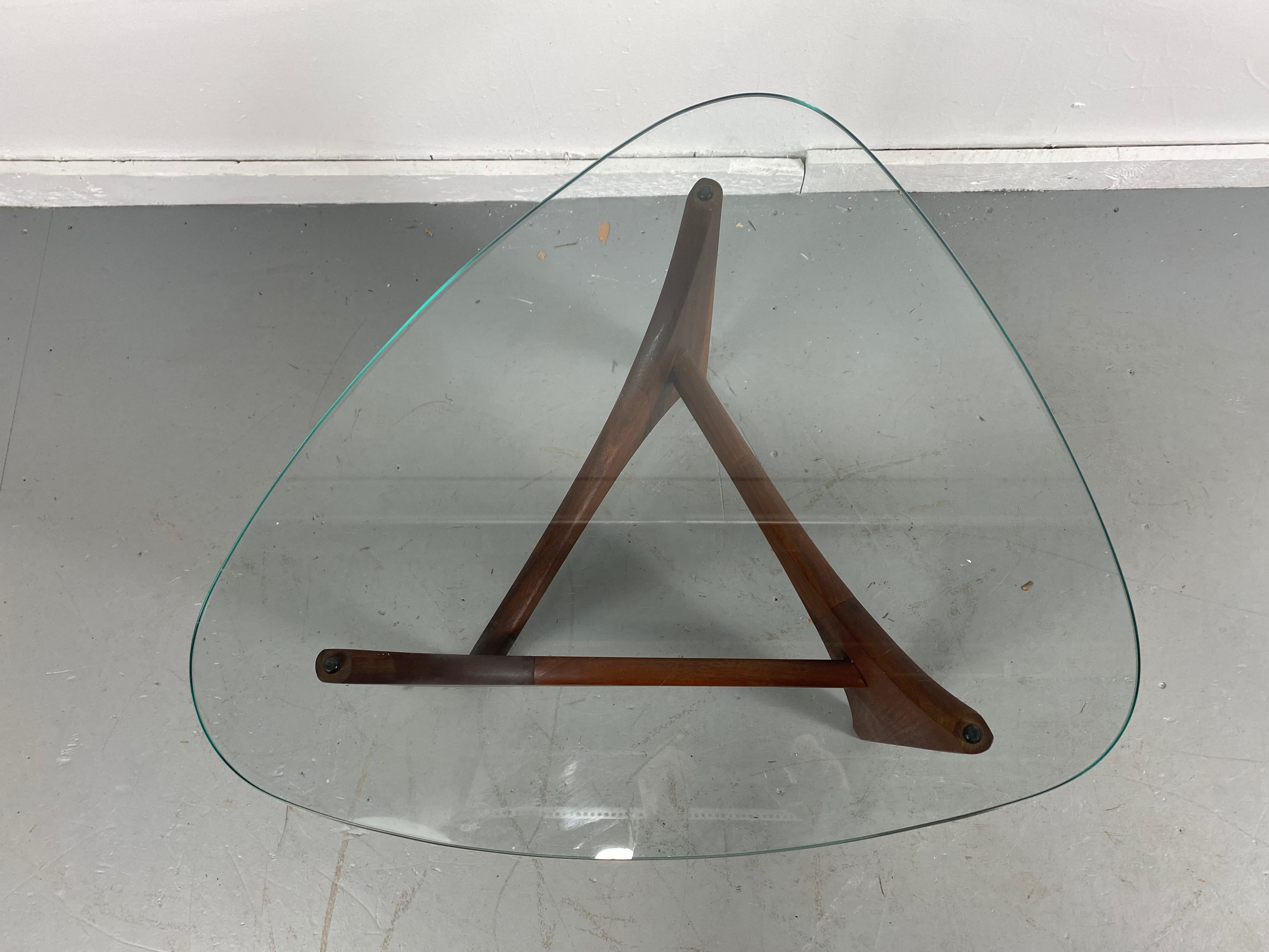 Fabulous Adrian Pearsall end table or cocktail table with a sculptural walnut base and a glass top in the form of a guitar pick. In excellent original condition, very tight and sturdy. Glass is perfect, Classic Modernist design.