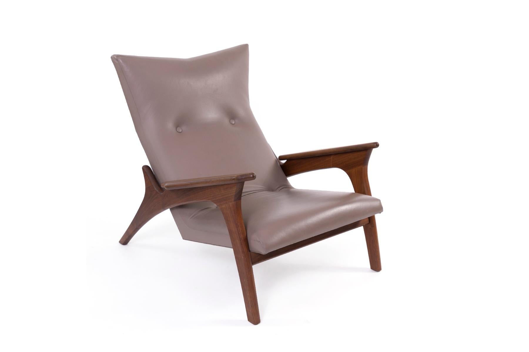 All original sculptural taupe leather lounge chair and accompanying ottoman by Adrian Pearsall. Ottoman measures 15.25