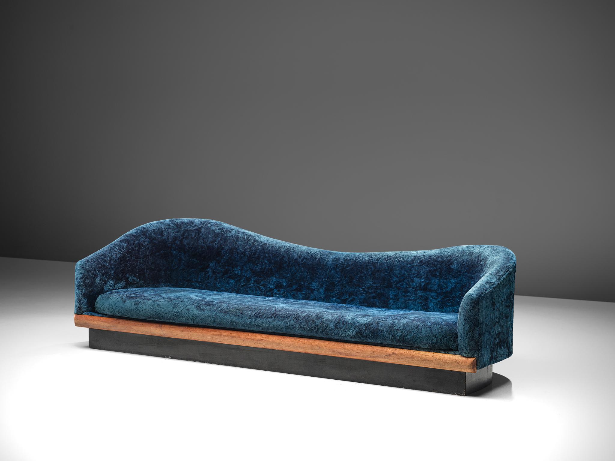Adrian Pearsall, 'Cloud' sofa to be reupholstered, walnut and fabric, United States, 1970s

This cloud sofa has a modern shape, and sinuous lines which create a comfortable and appealing look. The a-symmetrical sofa is a great addition to a living