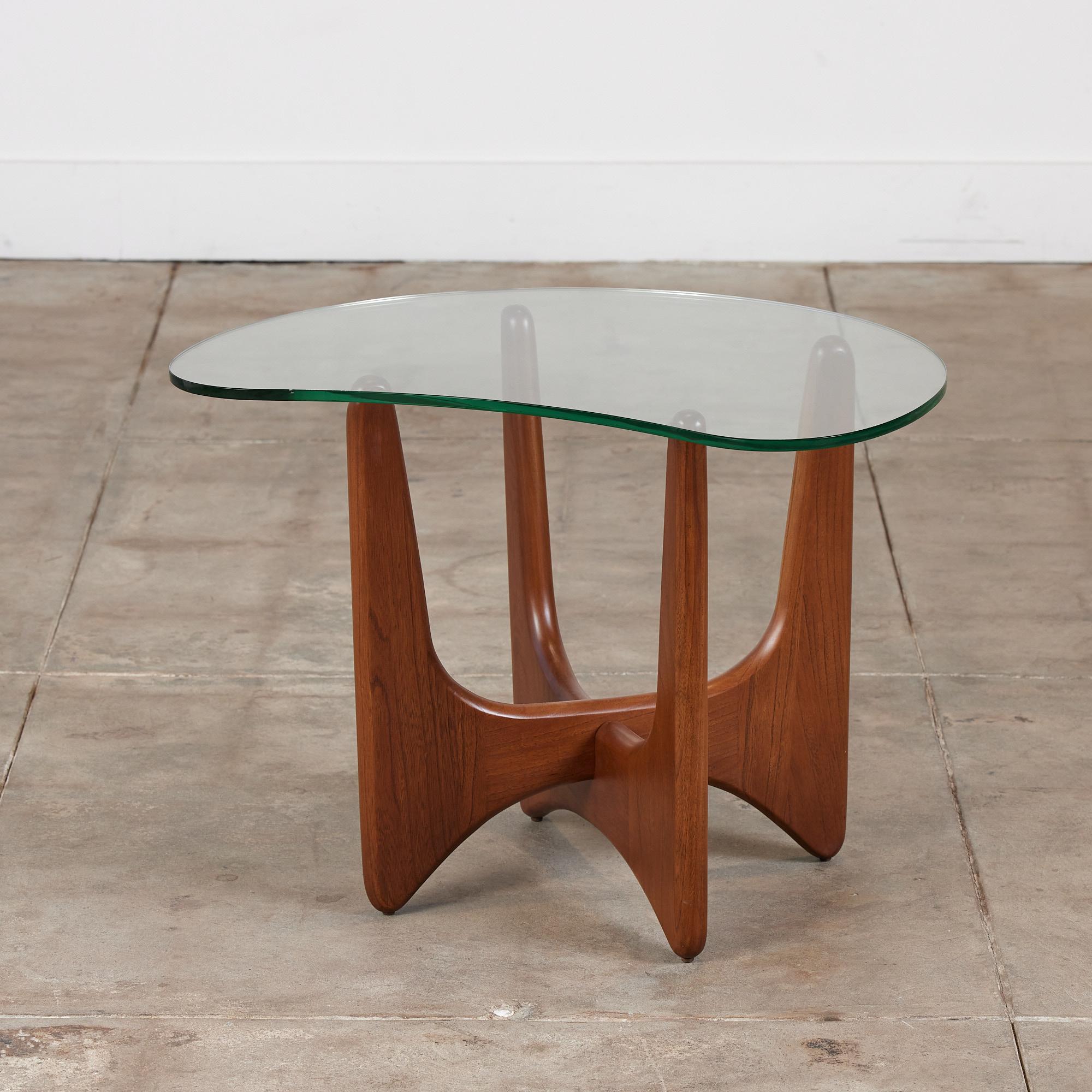 Adrian Pearsall for Craft Associates c.1960s, USA. This table features an organic glass shaped table top and beautifully refinished walnut base. The combination of the two elements makes this design a statement in any room.

Dimensions: 27” width
