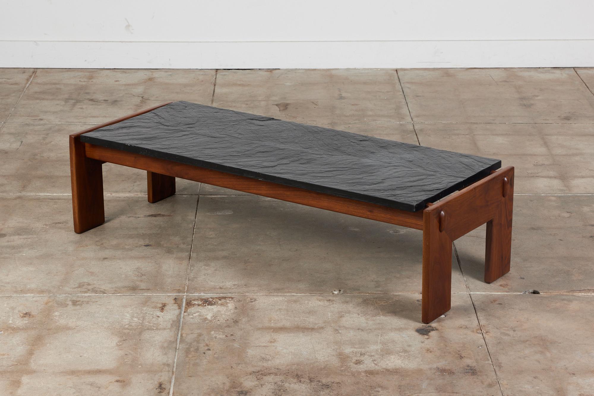 Adrian Pearsall for Craft Associates c.1960s, USA. This rectangular coffee table features a textured slate table top and beautifully refinished walnut base. The combination of the two organic elements makes this brutalist design a statement in any