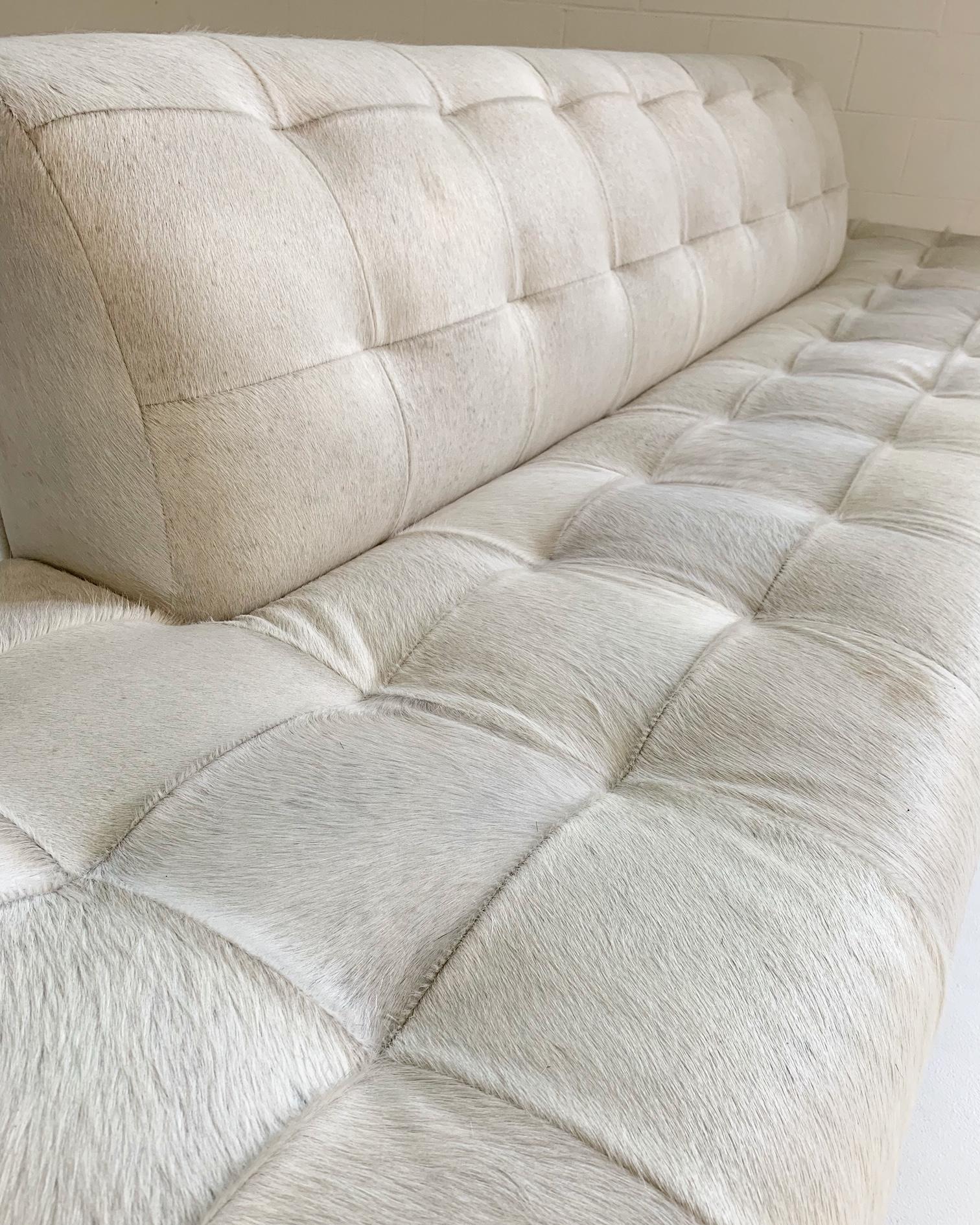 Our master upholstery team had a brilliant design idea when they came upon this vintage Adrian Pearsall sofa. The ends of the couch were originally attached side tables that were falling apart. We eliminated the tables and extended the upholstery