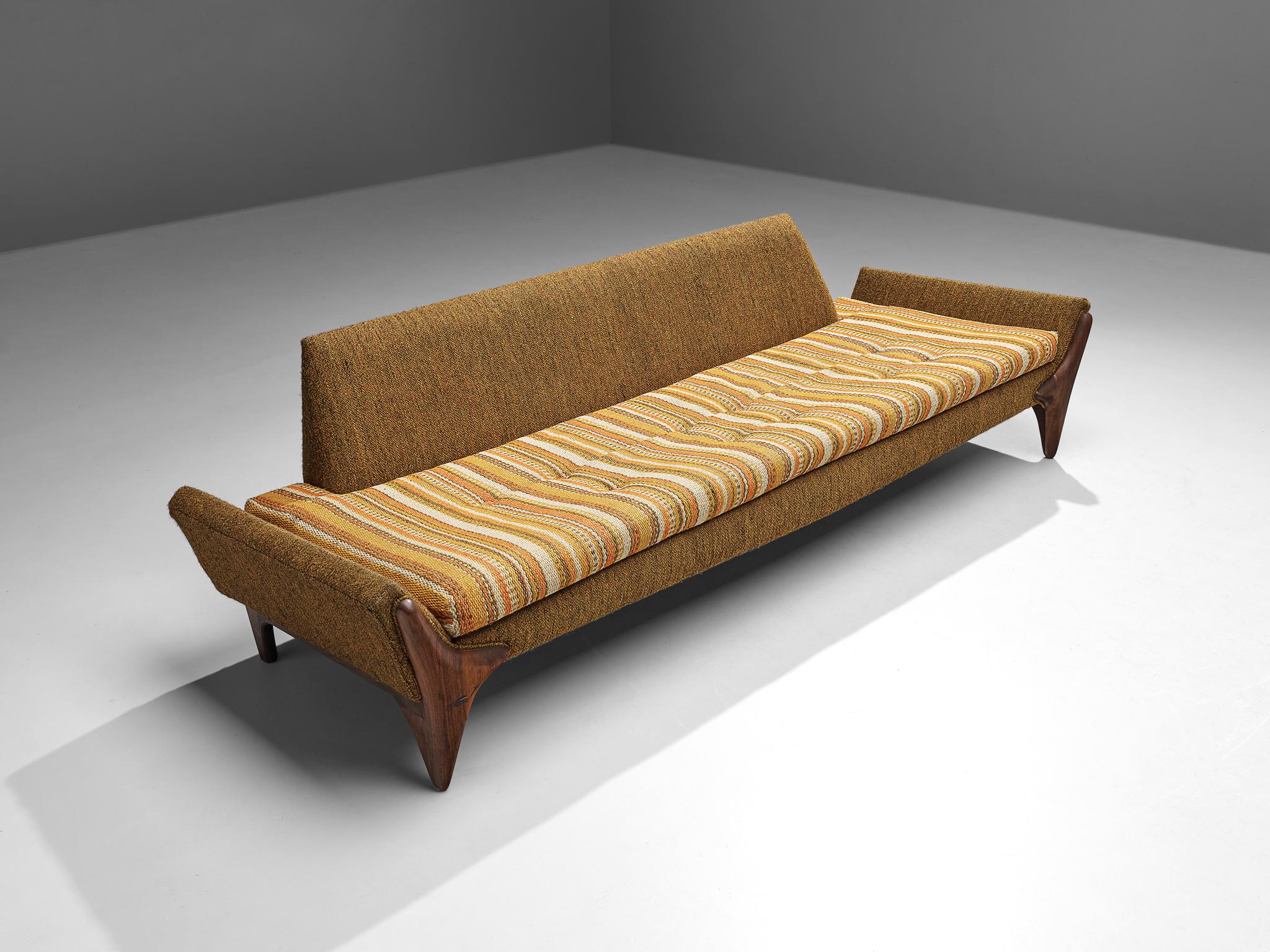 Adrian Pearsall, sofa, American walnut, fabric, United States, 1960s.

This beautifully shaped sofa designed by Adrian Pearsall is characterized by a solid construction, featuring clear lines and sharp shapes. The boomerang shaped legs uplift the