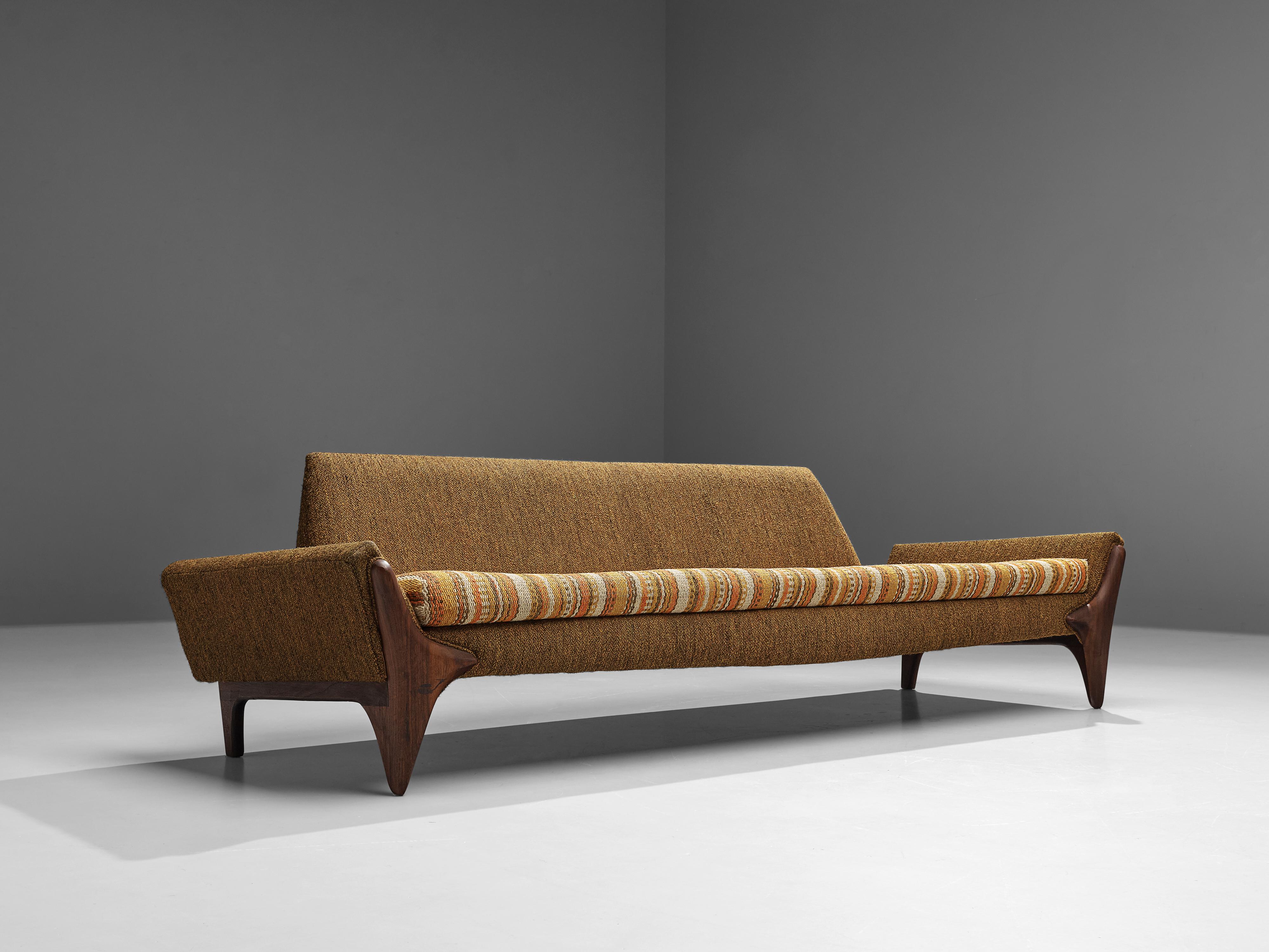 Adrian Pearsall, sofa, American walnut, fabric, United States, 1960s.

This beautifully shaped sofa designed by Adrian Pearsall is characterized by a solid construction, featuring clear lines and sharp shapes. The boomerang shaped legs uplift the