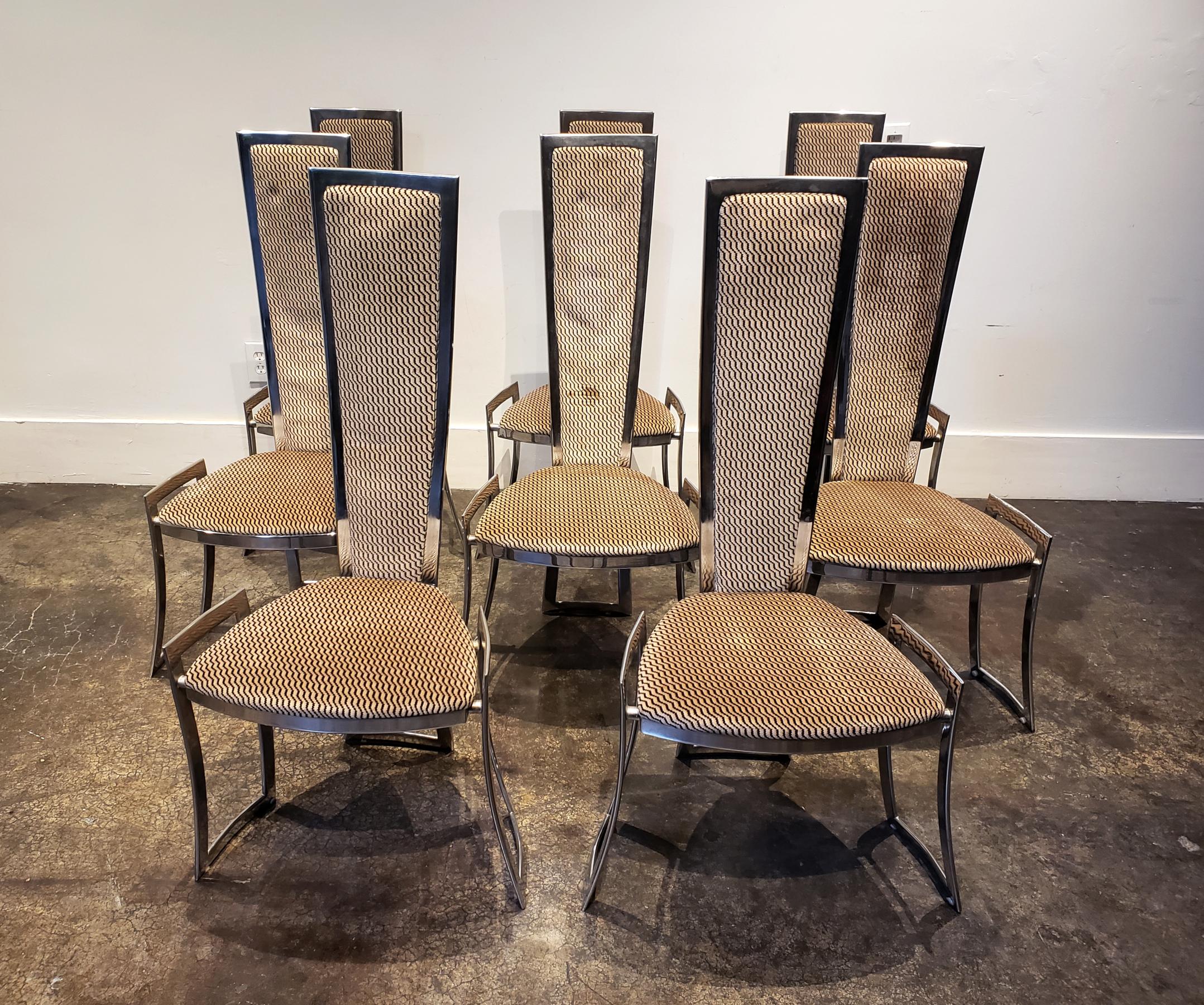 A stunning set of eight Adrian Pearsall Mid-Century Modern, polished steel, high-back dining chairs circa 1970s. Chairs have curved, rectangular, cut-out legs and original zig -zag black on tan upholstery.