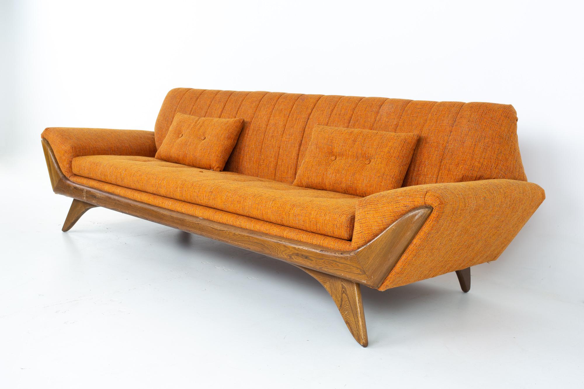 Adrian Pearsall style Kroehler midcentury re-upholstered orange gondola sofa
Sofa measures: 96 wide x 32 deep x 29 high, with a seat height of 16 inches 

All pieces of furniture can be had in what we call restored vintage condition. That means