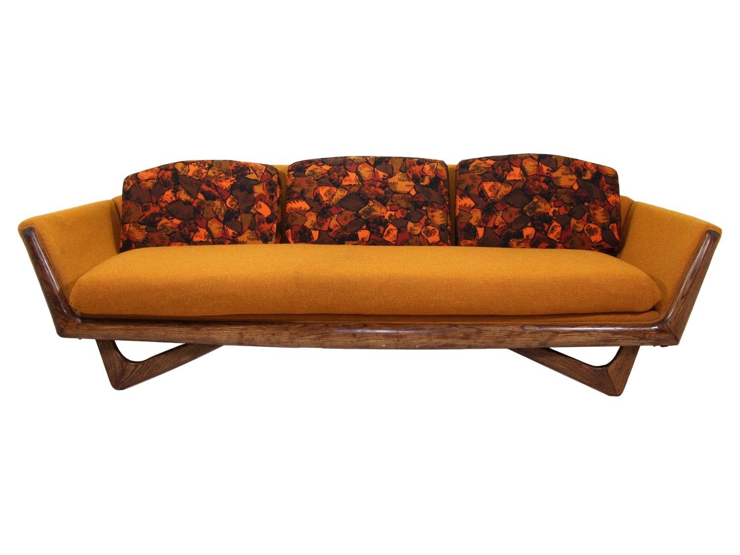 Mid-Century Modern sofa in the style of Adrian Pearsall made by Prestige Furniture Company.

Very good vintage condition. It has the original upholstery. There are some faint stains in the upholstery but no tears or damage. Walnut