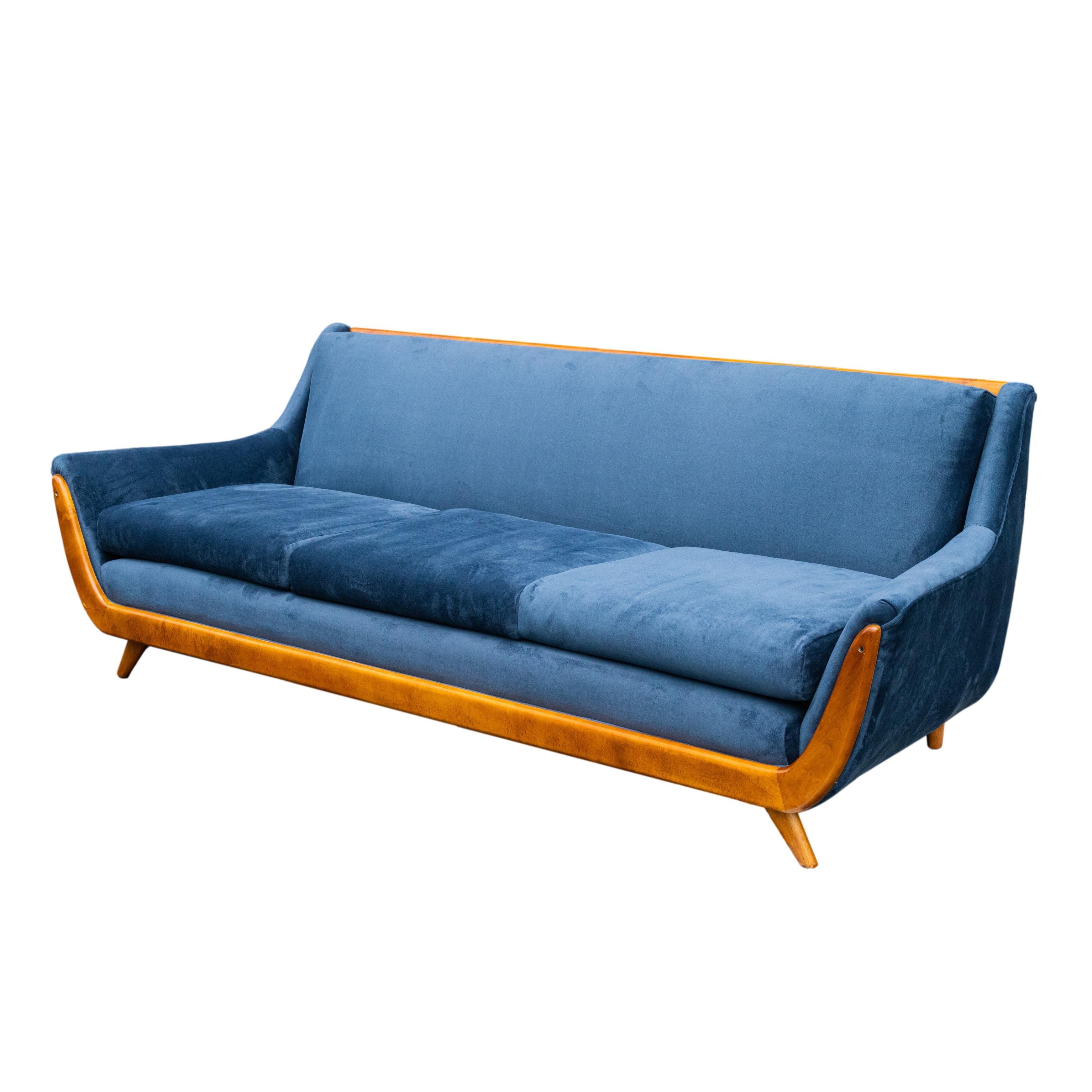 Mid-Centruy Modern Adrian Pearsall-style sofa, the frame in polished figured teak, newly reupholstered in blue velvet, American, ca. 1960.