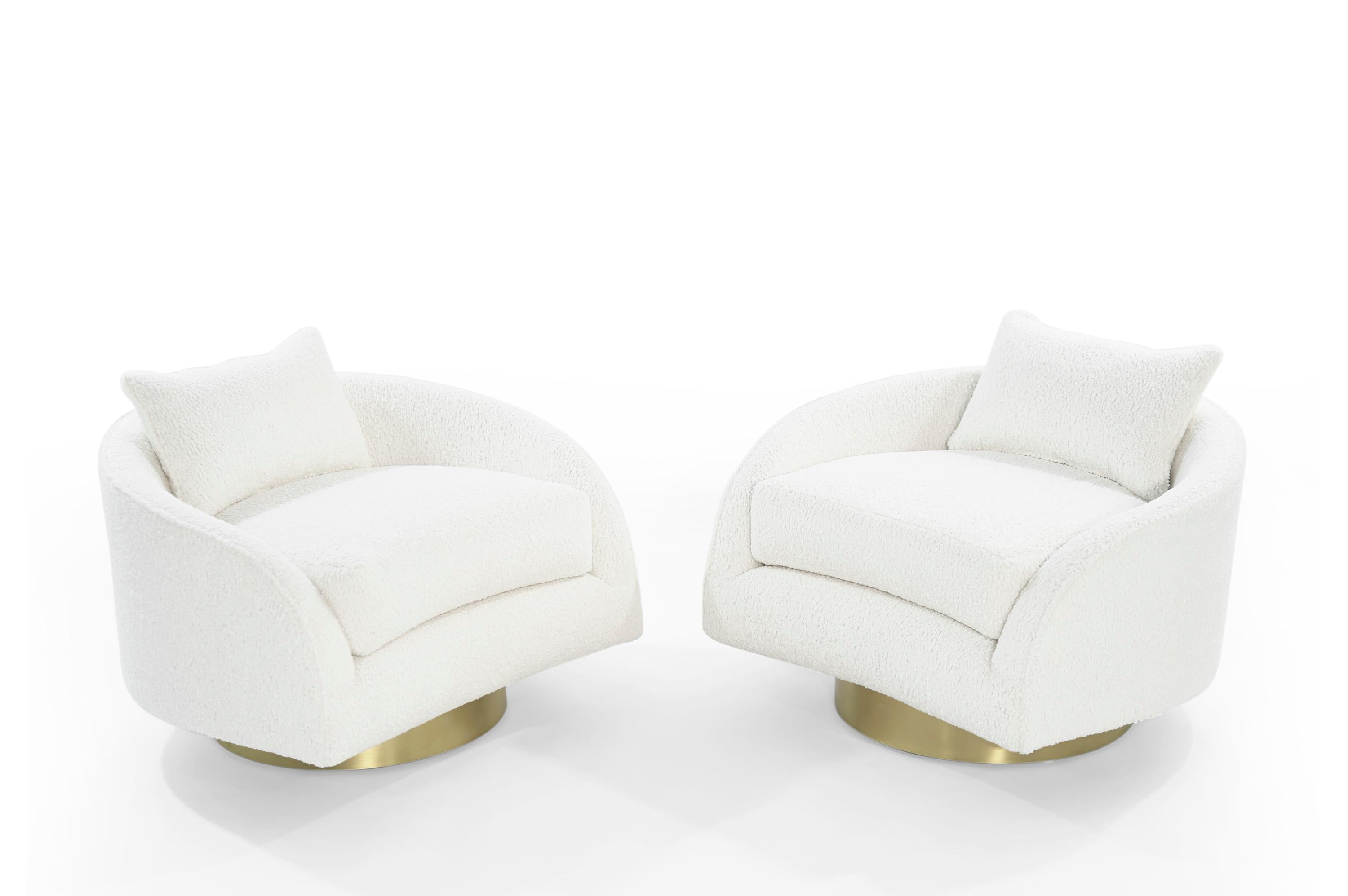Extremely comfortable set of low-wide profile swivel lounges designed by Adrian Pearsall for Craft Associates, circa 1950s.

Re-upholstered in white bouclé. Newly fitted brushed brass bases with new swivel mechanism. Theses are super comfortable