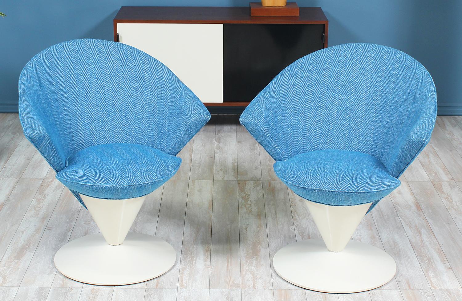 Outstanding pair of Swivel Cone chairs designed by Adrian Pearsall for Craft Associates in the United States circa 1960’s. The chairs feature a new tweed fabric upholstery in a vibrant blue adding style to any room. The swivel base is made of a