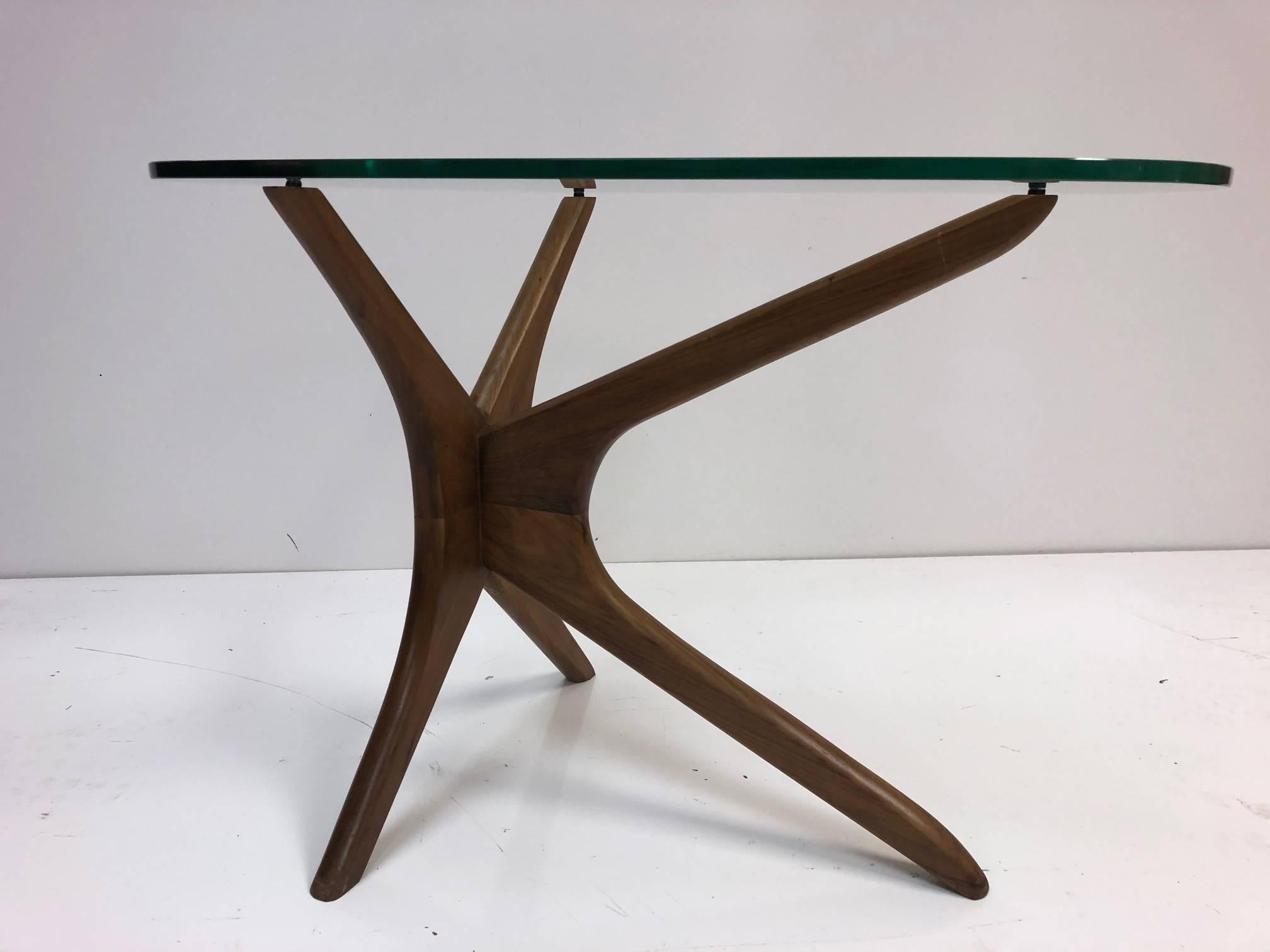 Adrian Pearsall tri-symmetric occasional table with glass top. Has a sculptural walnut base and a glass top.
  