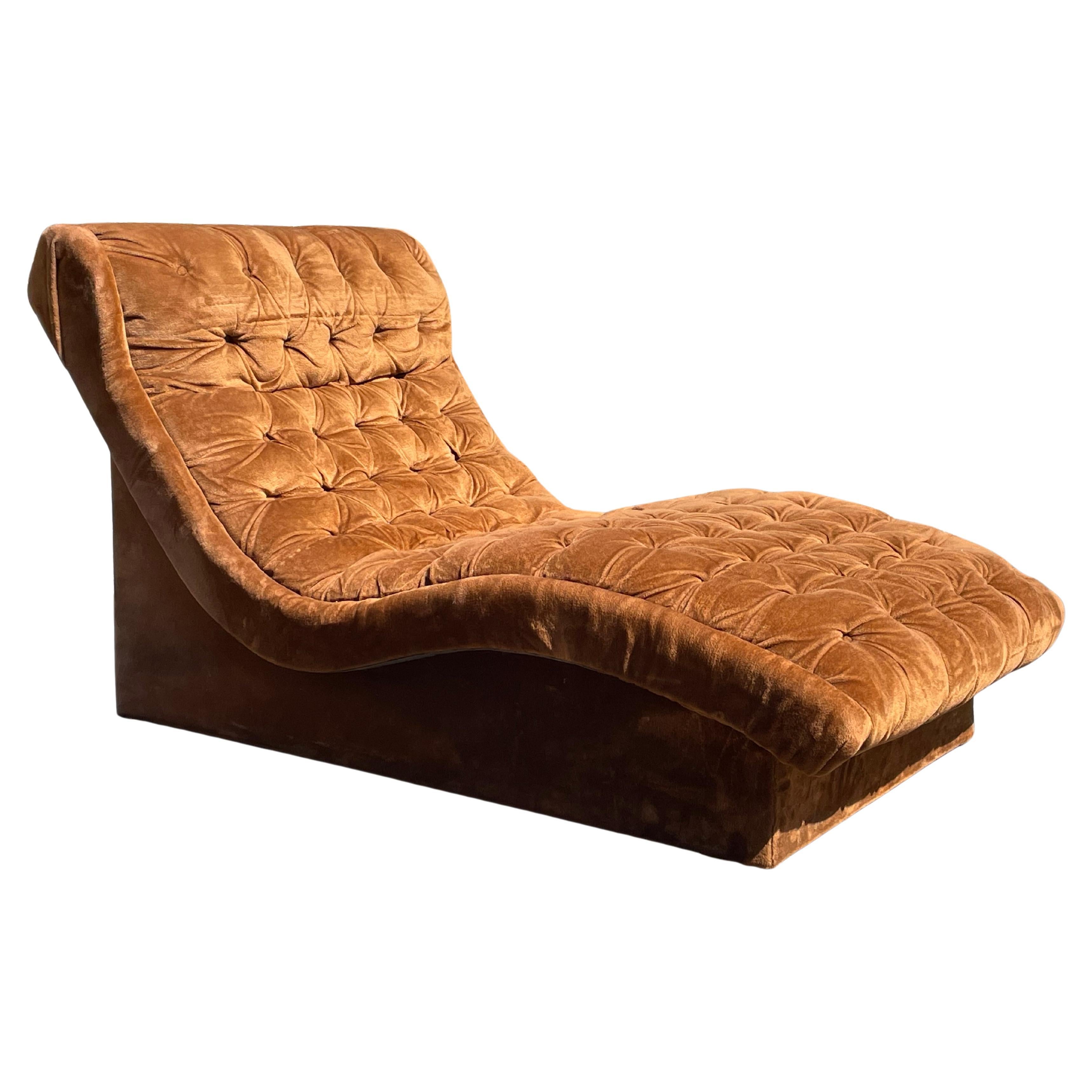 Magnificent tufted velvet mid-century chaise lounge chair in its original velvet rust. Attributed to Adrian Pearsall. This is just wow. Great lines on this chaise.

Very good vintage condition.

DIMENSIONS
67