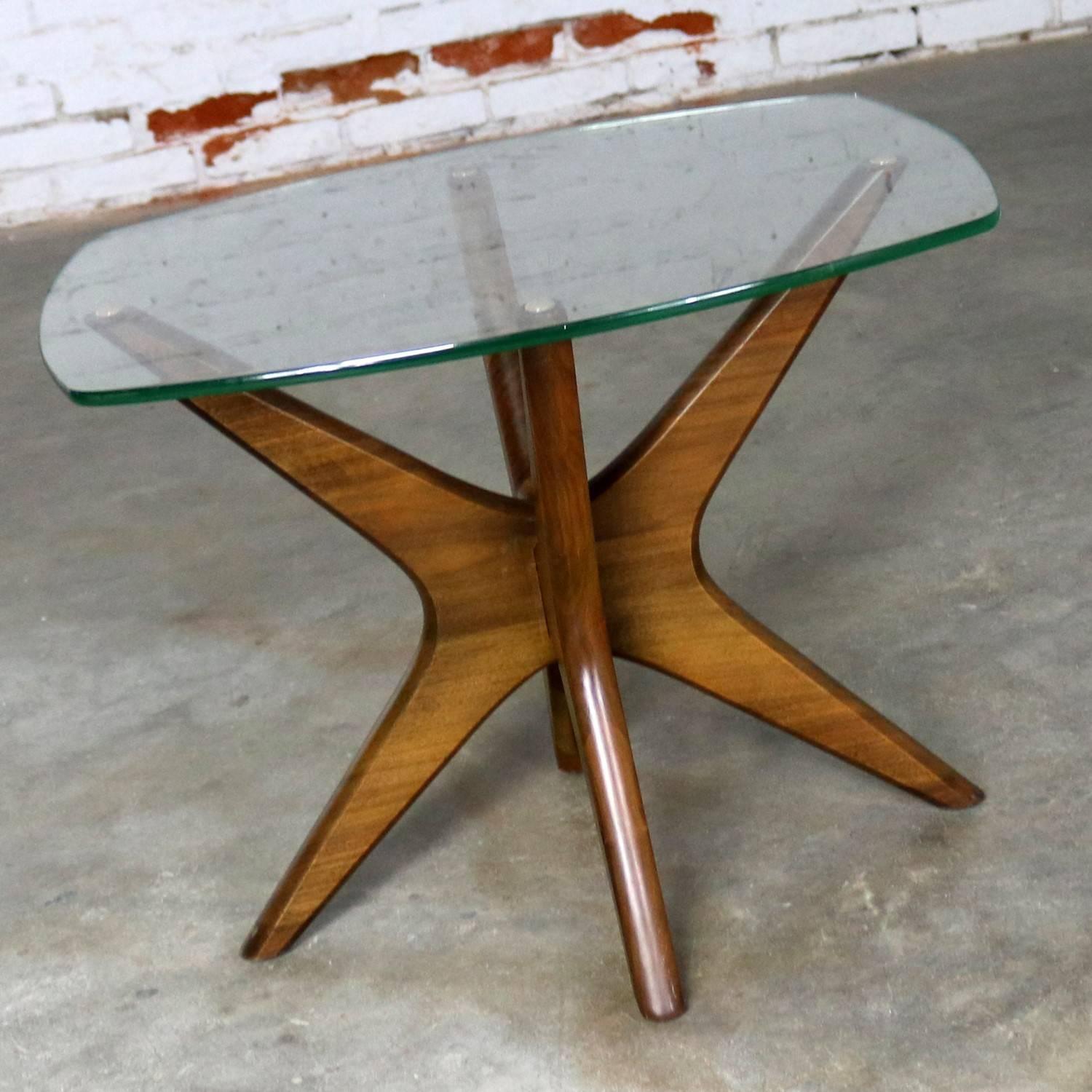 Handsome iconic Mid-Century Modern jacks side or end table by Adrian Pearsall for Craft Associates in walnut with glass top. This fabulous table is in wonderful original vintage condition. It does have a couple nicks in the legs as you would expect
