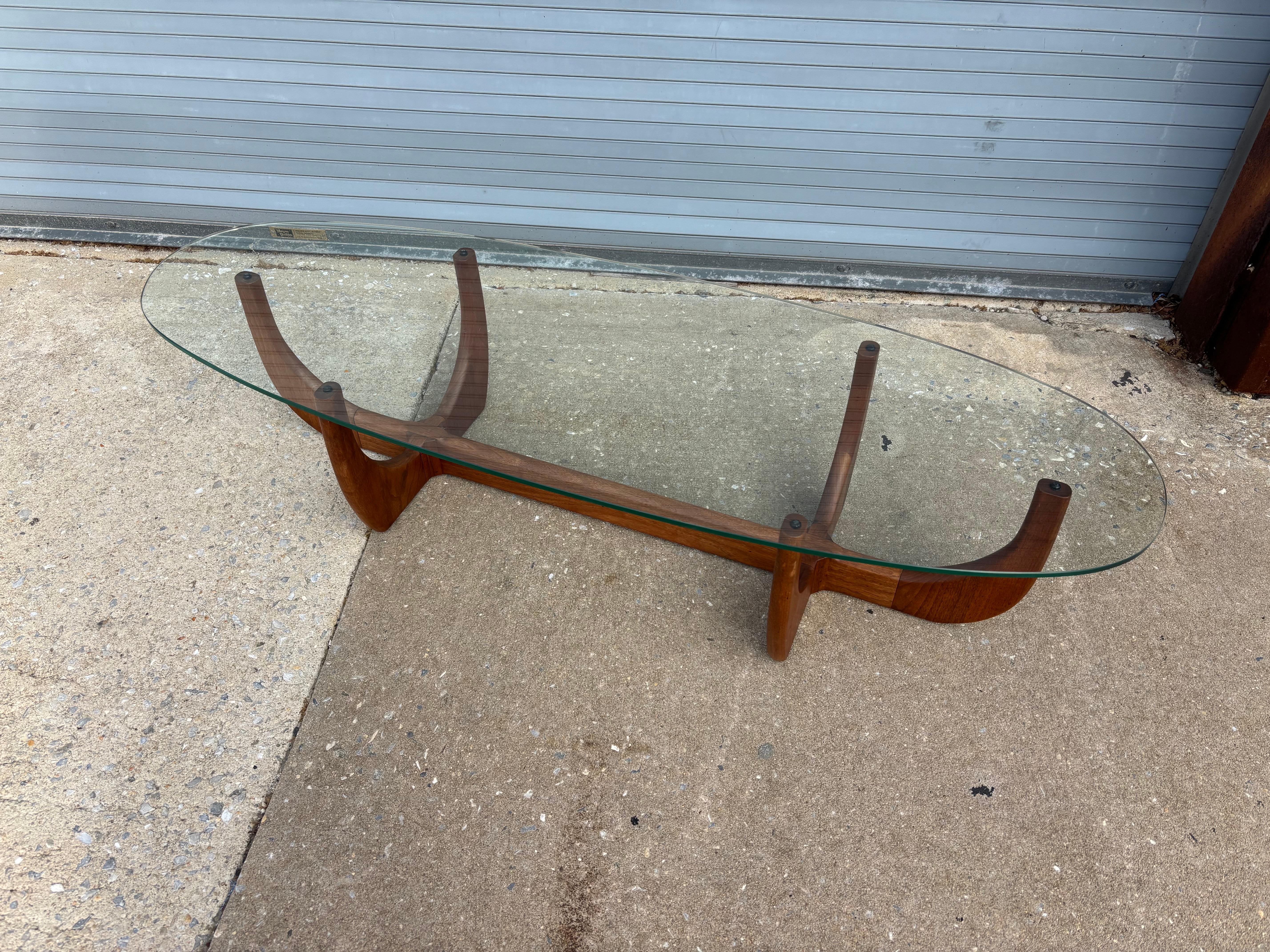 Adrian Pearsall Attributed Glass and Walnut Coffee Table.  Base has the look and feel of a Skeleton.  Overall in nice shape and can't say I've seen this model before!  Glass looks original and is clean!