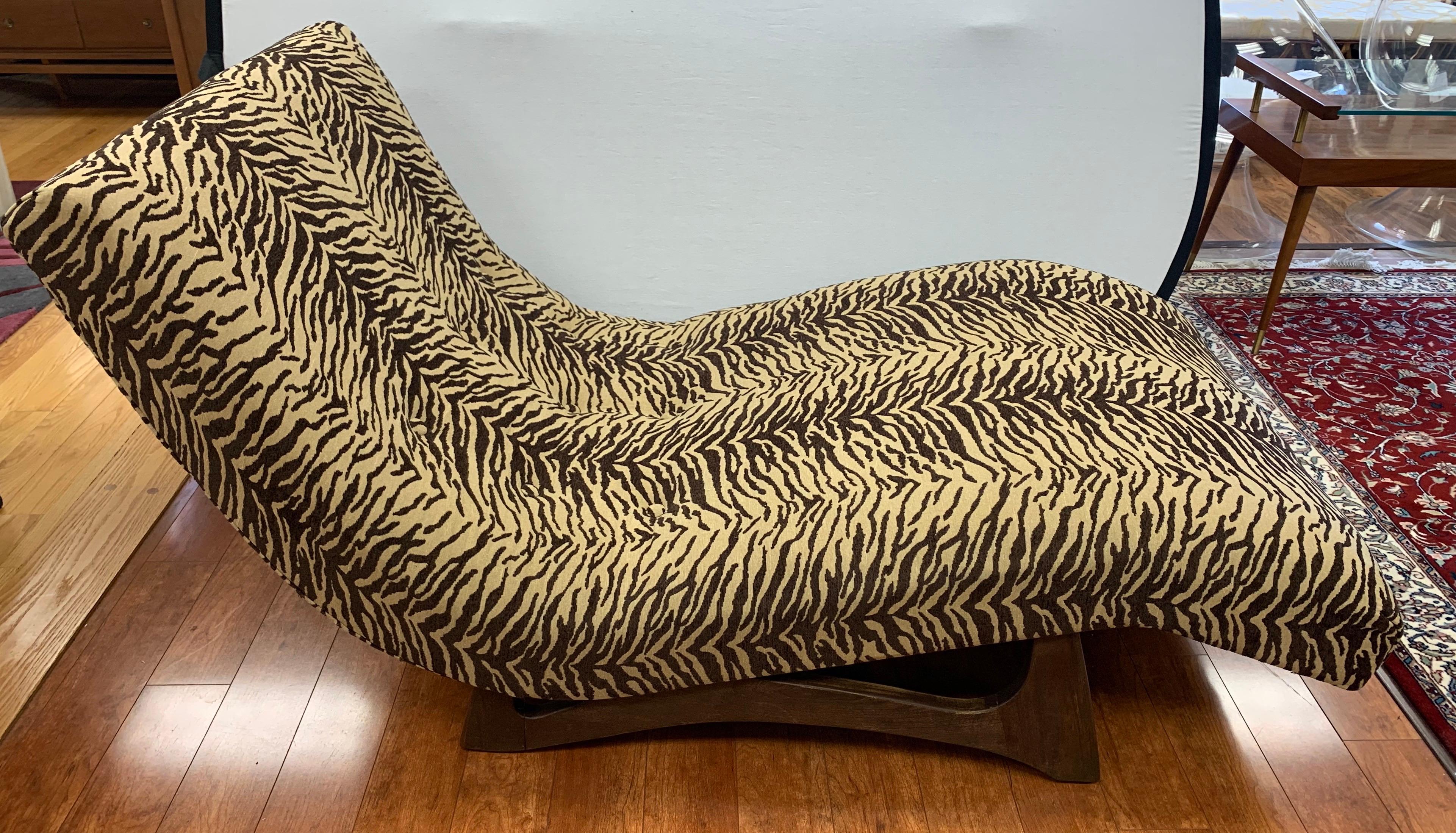 Magnificent Adrian Pearsall wave chaise that has been newly upholstered in a vibrant zebra print fabric.  All Craft Associates tags are present.

Iconic Pearsall seating is some of the most sought after pieces in the midcentury cannon of furniture,