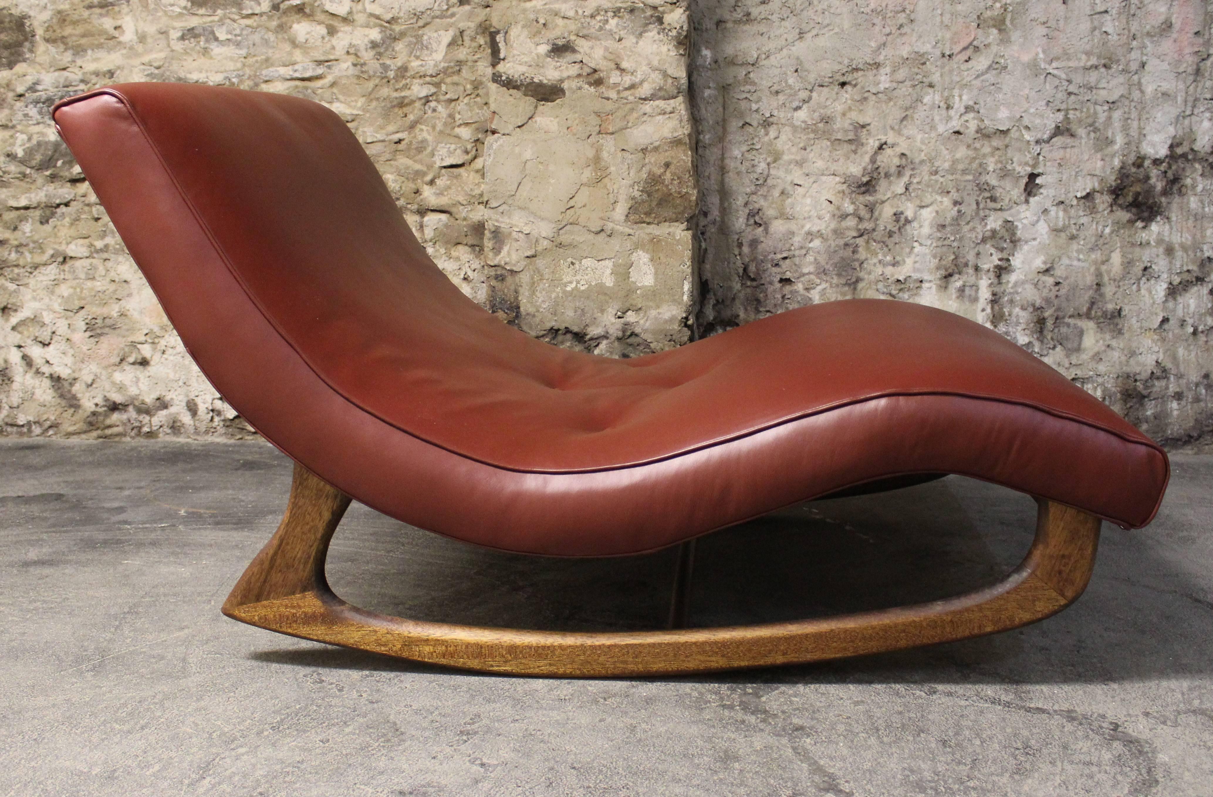 Mid-Century Modern wave chaise/rocking chair by Adrian Pearsall. This has been newly upholstered in leather and has a wide profile and walnut frame in a beautiful modernist form.