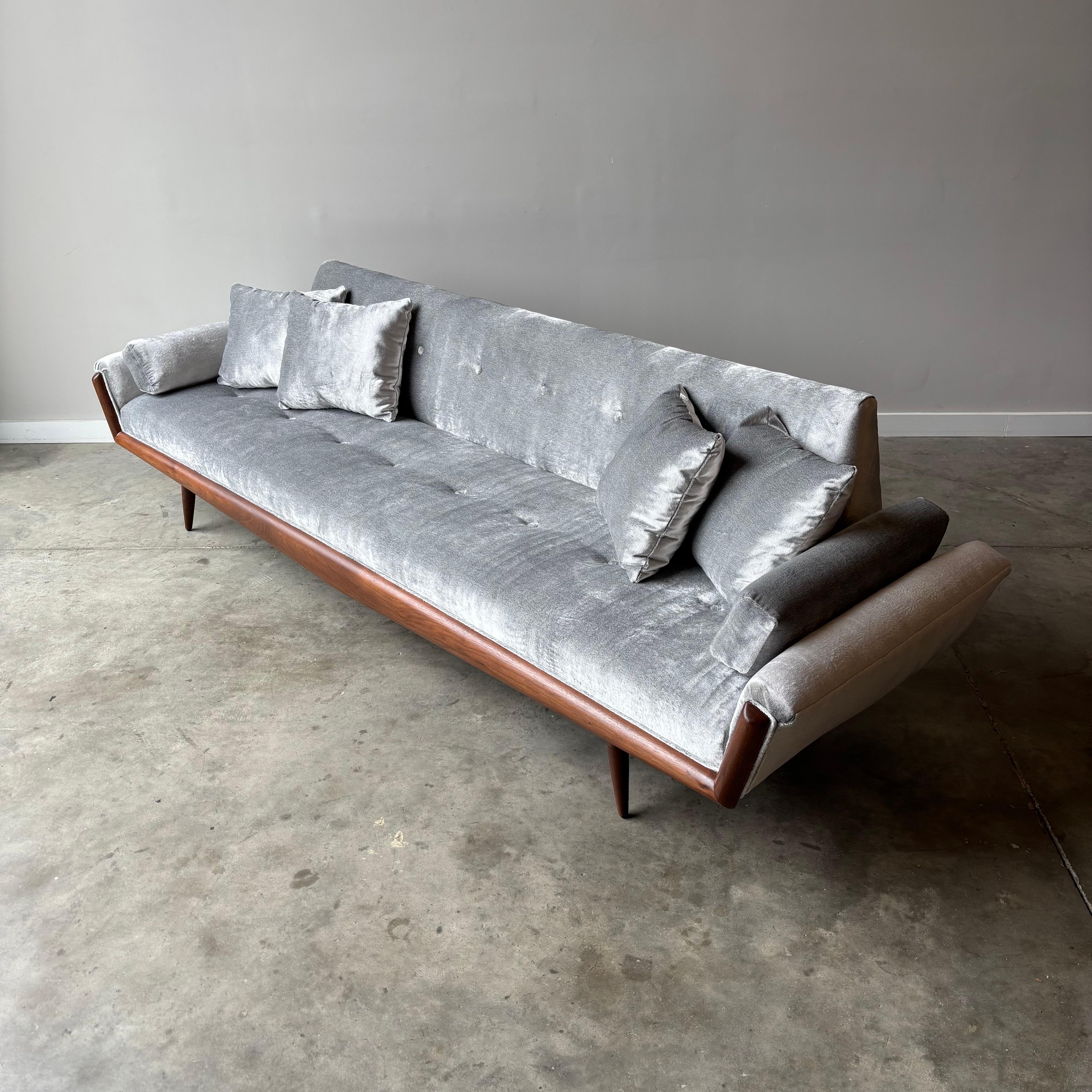 
Experience mid-century modern luxury with this exceptional Adrian Pearsall wing arm sofa, masterfully restored and wrapped in sumptuous Italian velvet. This sophisticated piece showcases Pearsall's refined design sensibility through its elegant