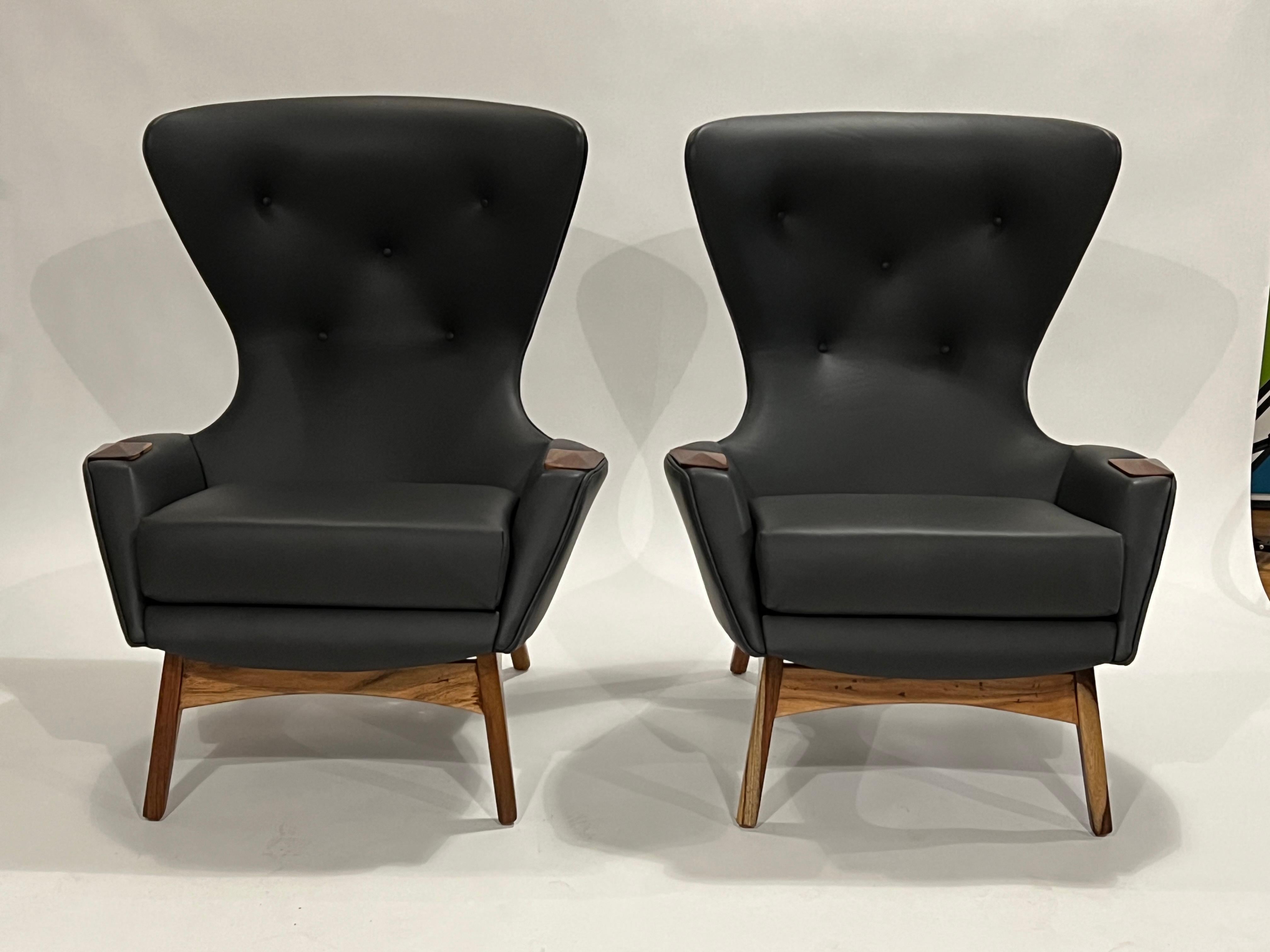 Pair of Adrian Pearsall wing chairs Model 2231-C in dark green leather (high quality hide from Herman Miller which almost looks black) and wood frame and accents which have been stripped and finished with a clear coat to expose the mixed woods.