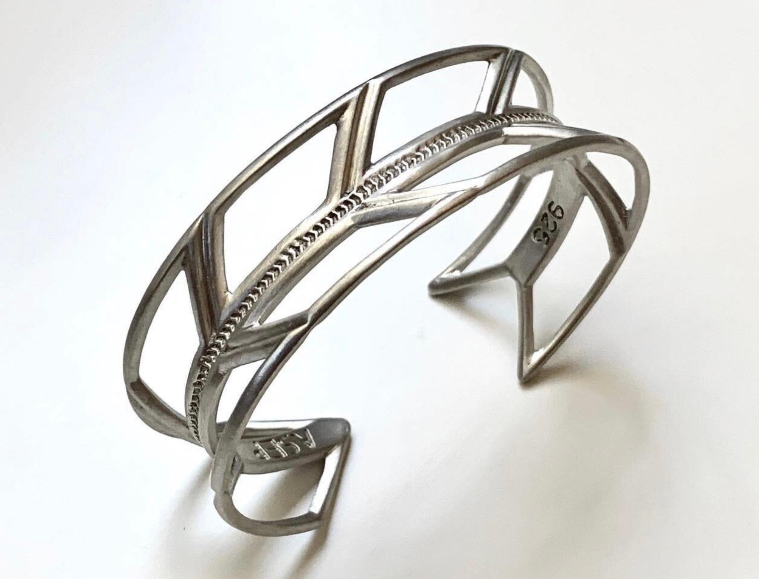 Infinity Bracelet, Polished - Sculpture by Adrian Standing Elk Pinnecoose 