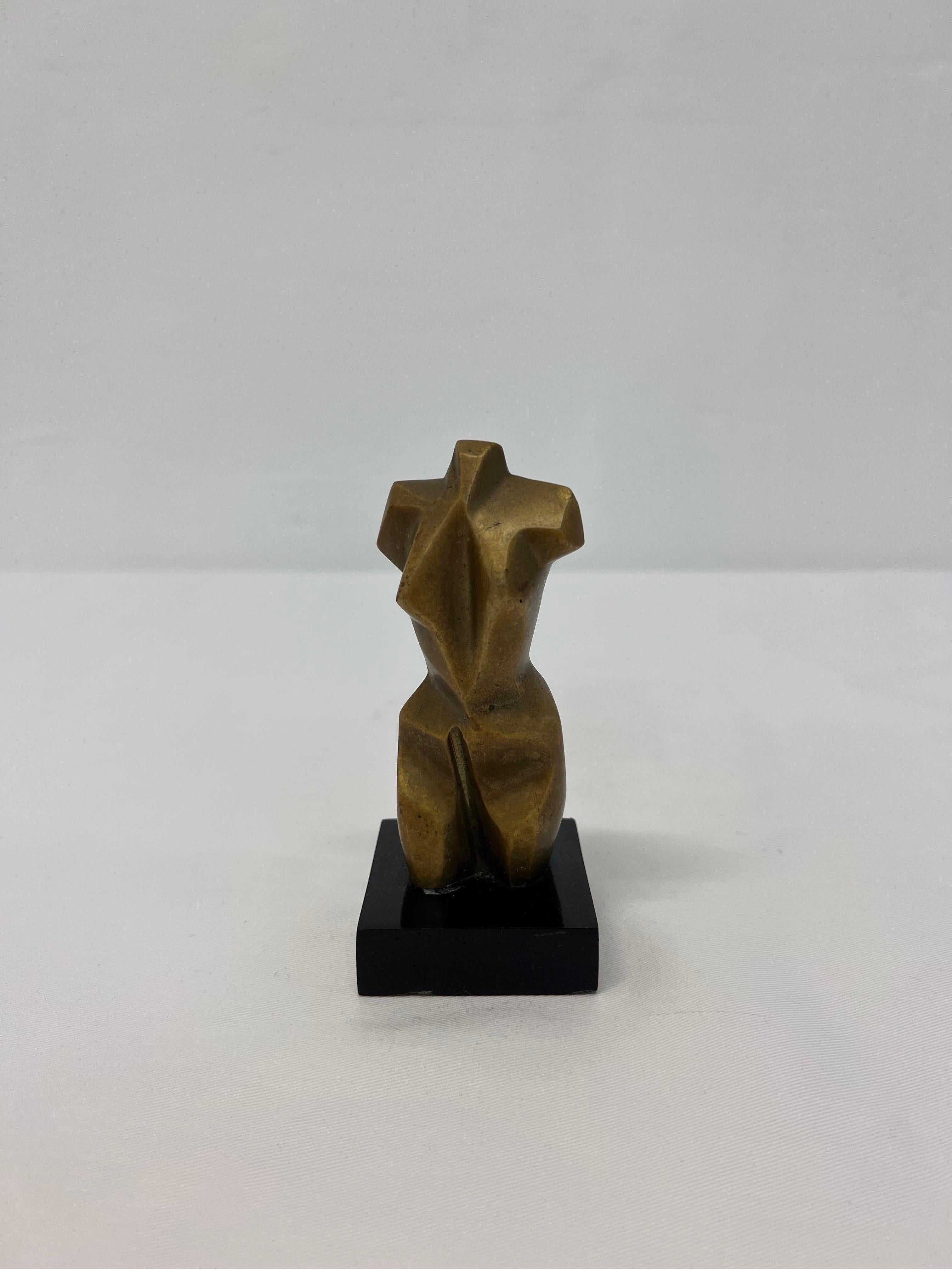Patinated bronze female torso sculpture on black marble base by Brazilian artist and sculptor Adriana Banfi.