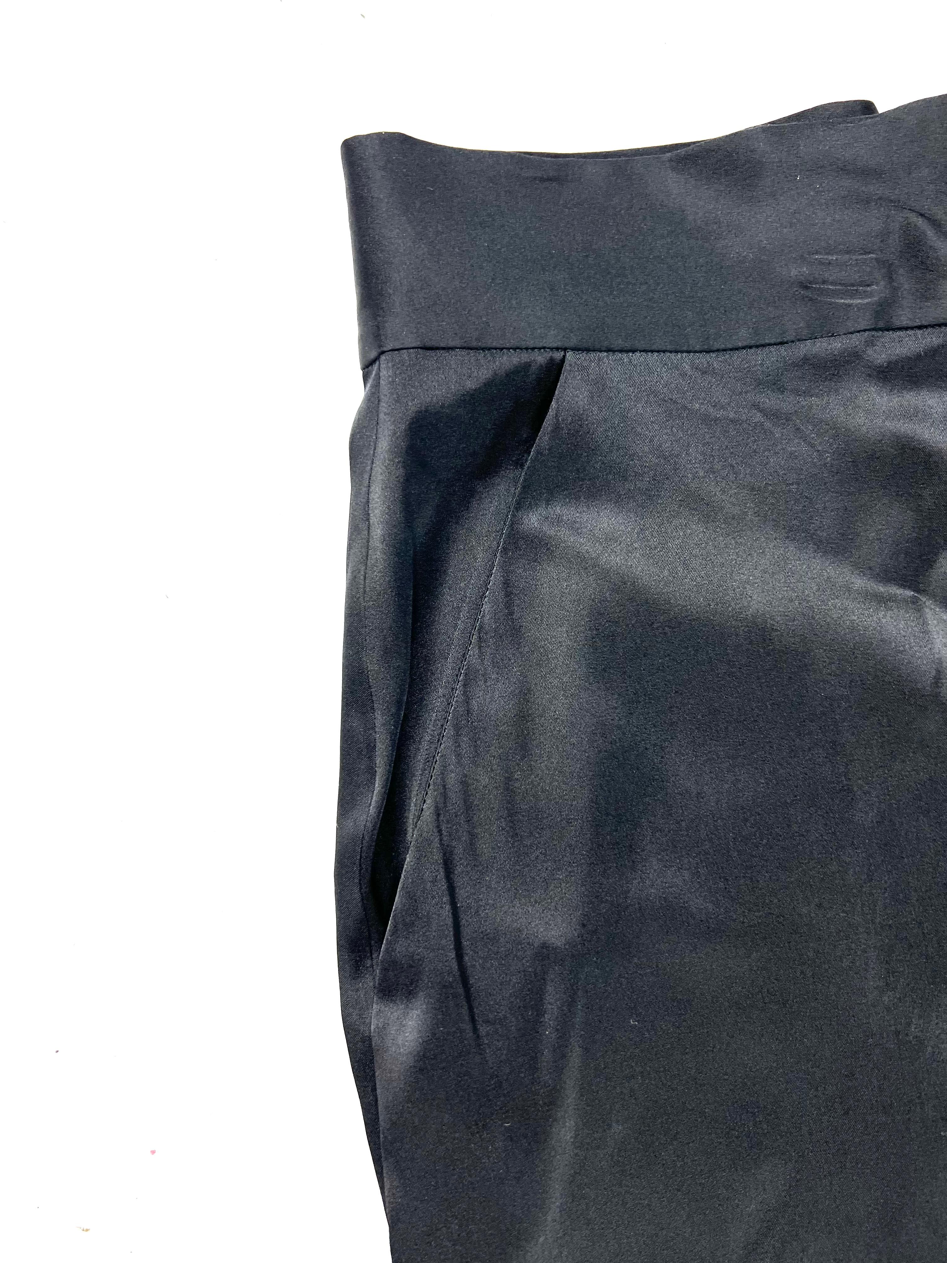 Product details:

The pants feature black satin finish with wide leg style, concealed rear zip closure and side pockets detail. The leg width measure 13” across. 