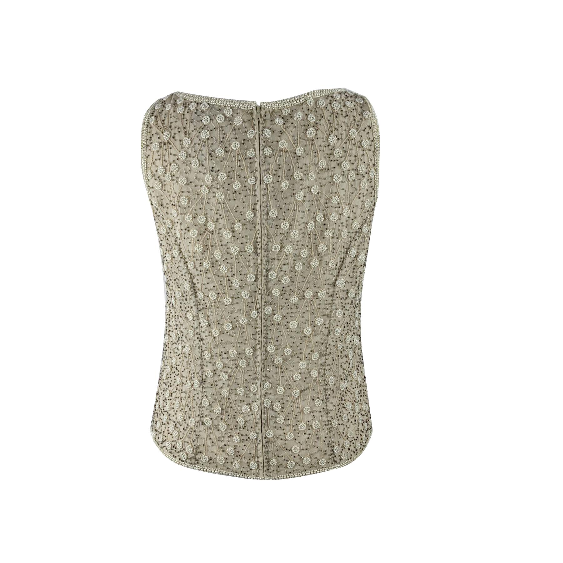 Beautiful Adrianna Papell beaded sleeveless top. Beige color. Full back zip. Composition: 100% Silk. Made in India. Size: 10 US (it should correspond to a SMALL/MEDIUM size)

Details

MATERIAL: Silk

COLOR: Beige

MODEL: Top

GENDER: Women

COUNTRY
