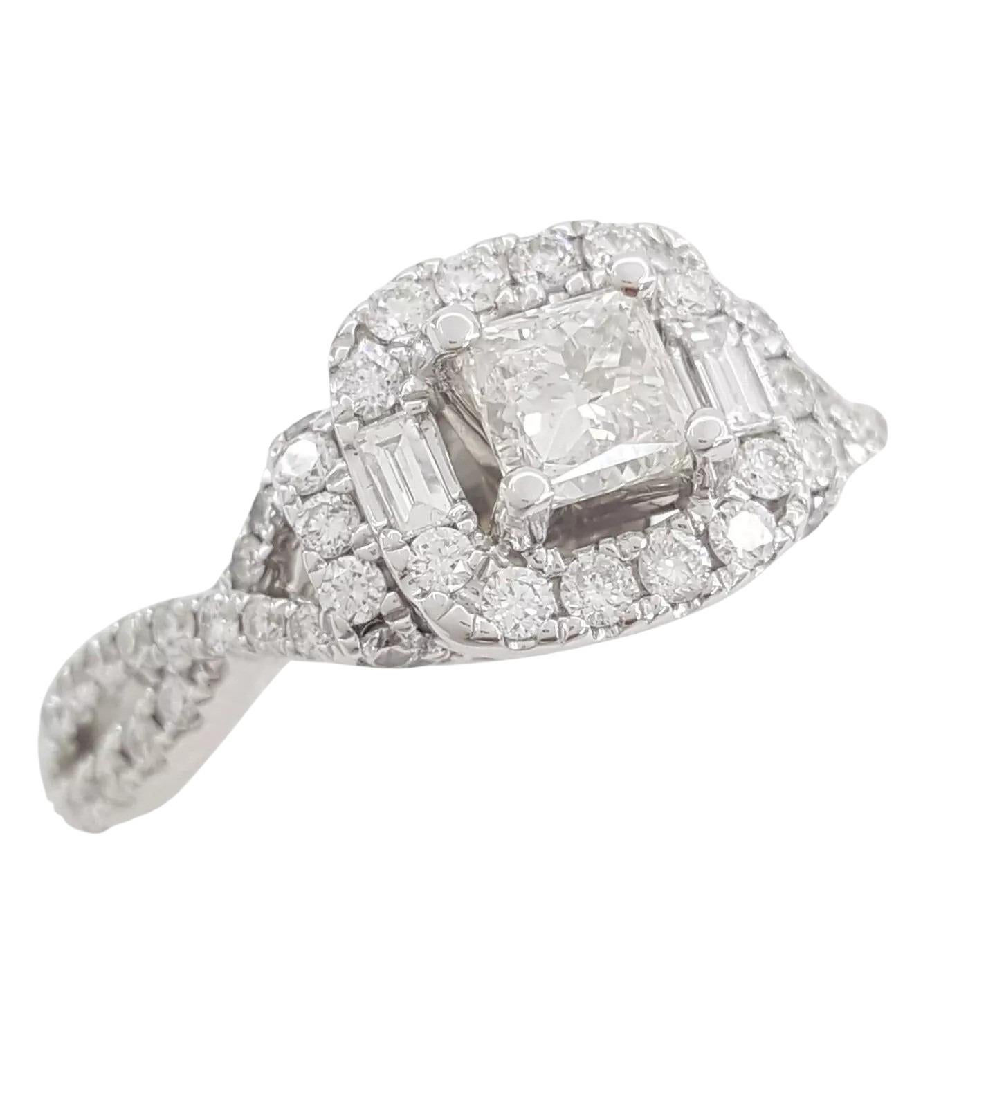 For sale is a stunning Adrianna Papell 14K white gold engagement ring with a crossover halo design.

This size 7 ring weighs 4.5 grams and features a 0.3 ct natural Princess Brilliant Cut diamond at its center, graded H in color and I1 in