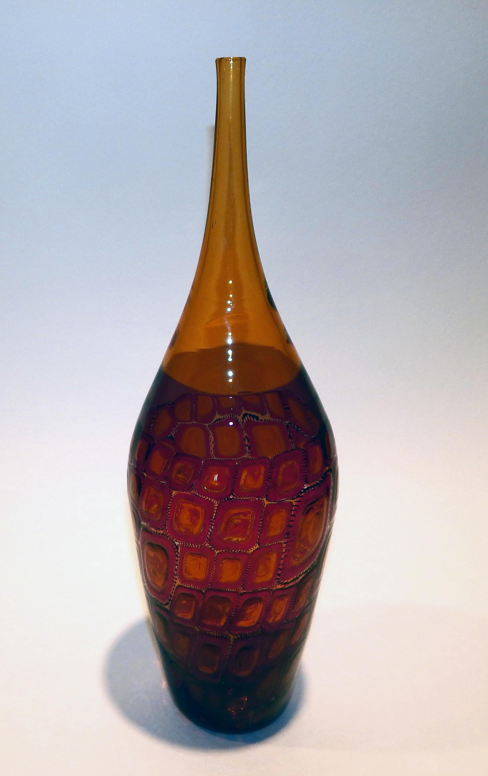 Adriano dalla Valentina Murano glass amber bottle with Mosaica Motif on the lower half.
Signed “Valentina” and dated 2003 on the base. In excellent condition. Measures: 14