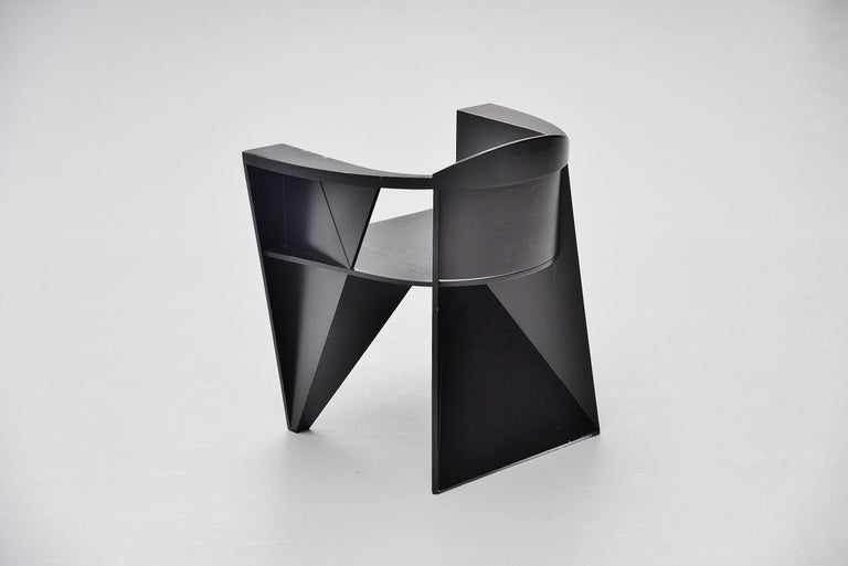 Fantastic constructivistic shaped Postmodern armchair designed by designer duo Adriano e Paolo Suman, manufactured by Giorgetti Spa, Italy, 1984. This chair is from the Matrix series designed in 1984. Very nice constructivist chair made of beech