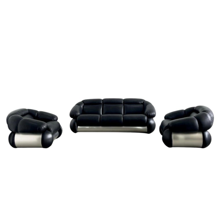 
This sofa and armchairs set is a Space Age design furniture realized by the Italian designer, painter and sculptor Adriano Piazzesi in the 1970s.

Including a three-seat sofa and two armchairs realized using metal, wood and Black