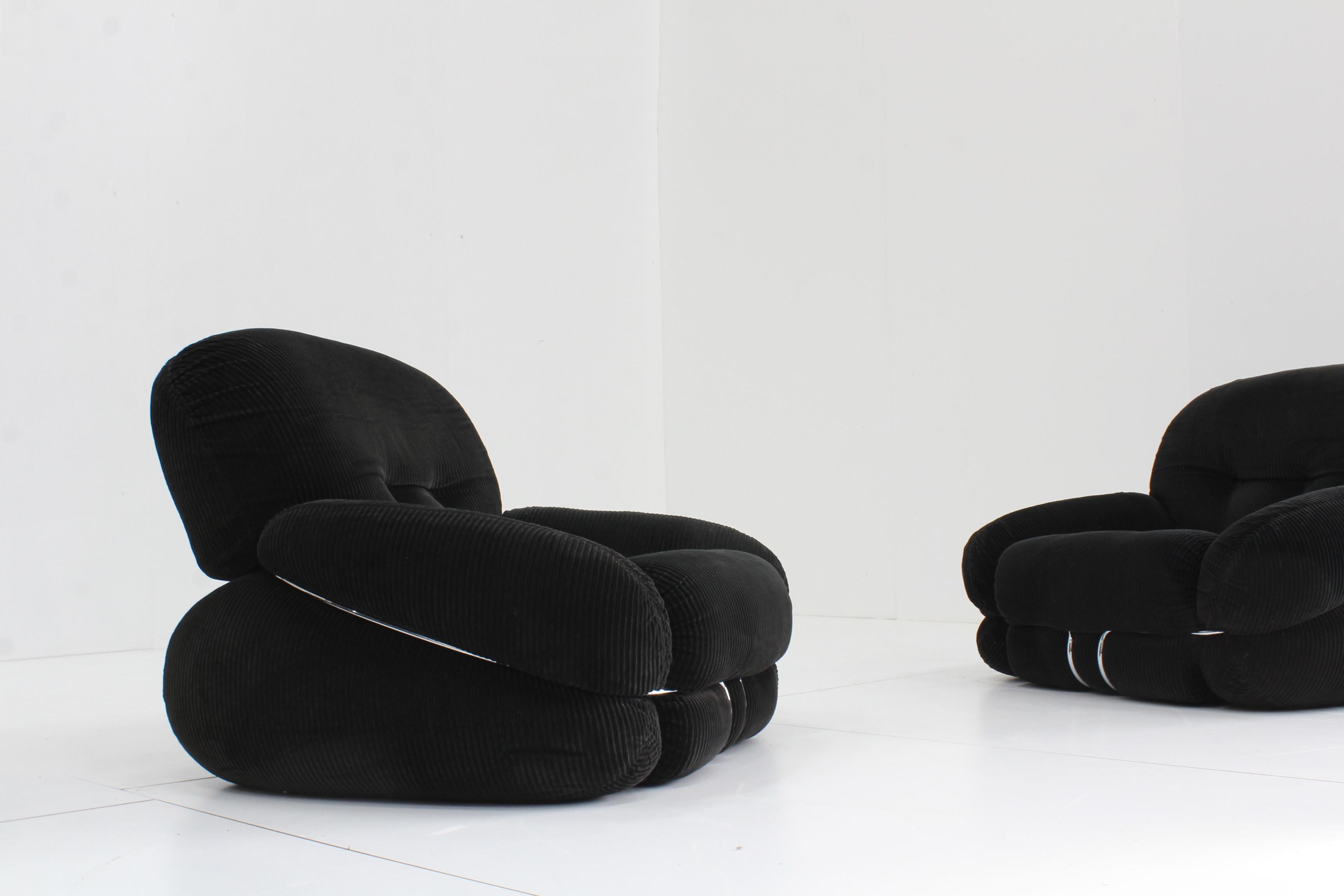 Black cordaroy Okay armchair designed by Italian designer Adriano Piazzesi in the 1970s. This comfy chair is in a good condition with minor traces of use. This chair has a black cordaroy / rib fabric with a chromed metal structure.

Price is for 1