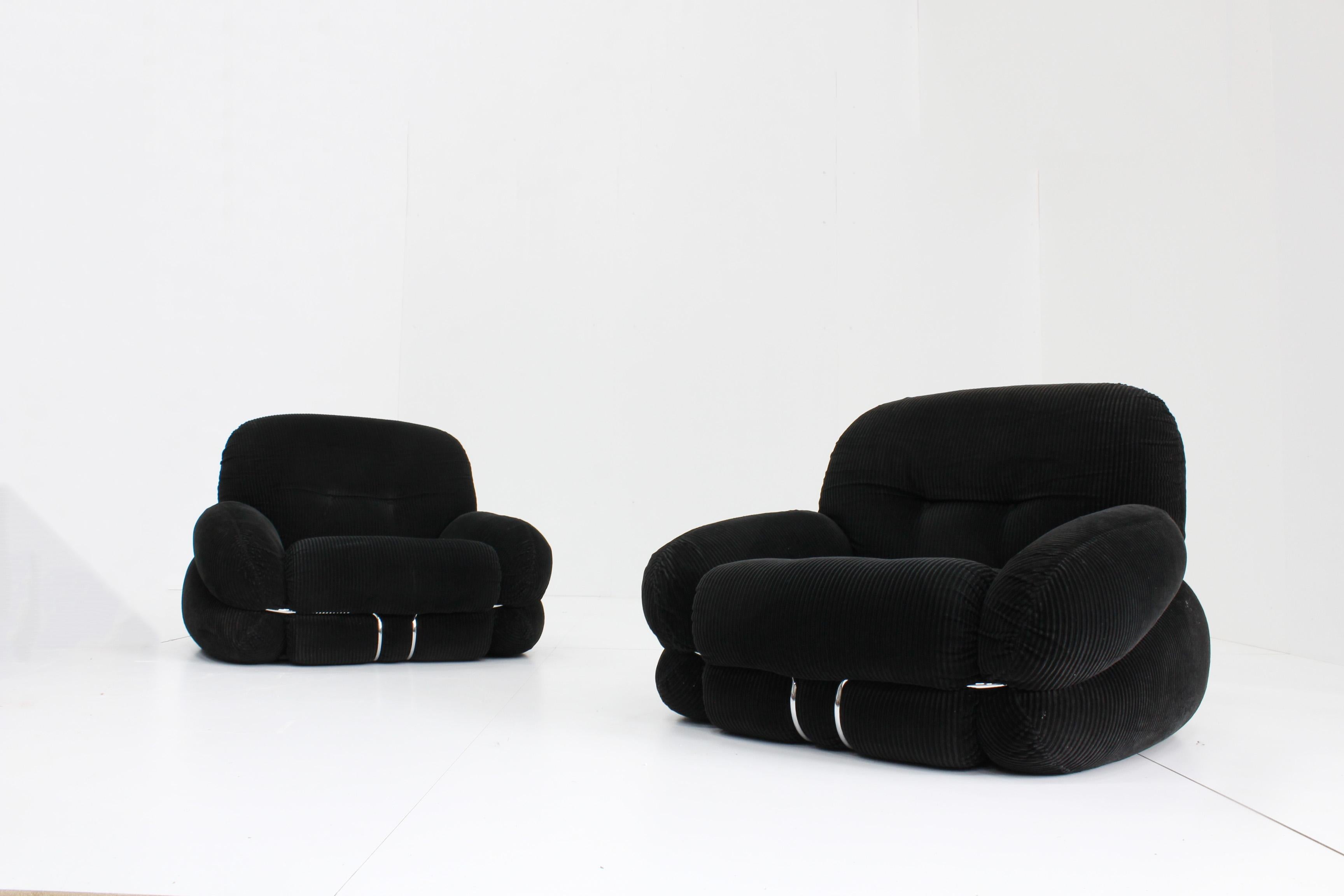 Set of Okay armchairs designed by Italian designer Adriano Piazzesi in the 1970s. These comfy set of chairs are in a very good condition with minor traces of use. This edition is in a black rib fabric with a chromed metal structure.

Price is for