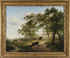 Cattle and figures on a riverside lane, within a woodland landscape