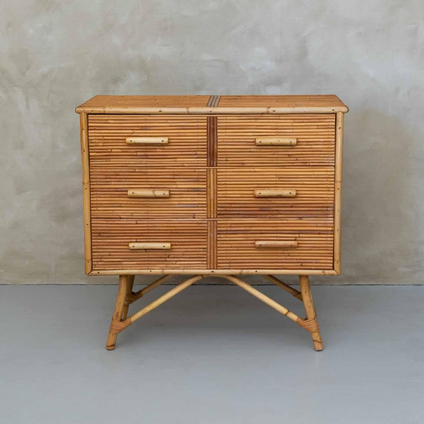 Beautiful split bamboo dresser by Adrien Audoux and Frida Minet from France 1960's. Three-drawer dresser with bamboo knobs. Thick bamboo legs with wrapped rattan detail. Original finish shows varying shades of split bamboo. Incredible statement