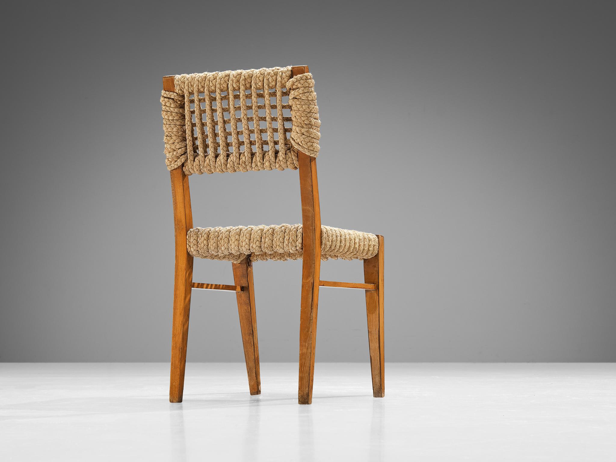 Adrien Audoux & Frida Minet for Vibo Vesoul, dining chair, beech, straw, France, 1950s. 

The seating and backrest are made of woven hemp from the abaca plant which is close to the species of the banana plant. This natural style is typical for the
