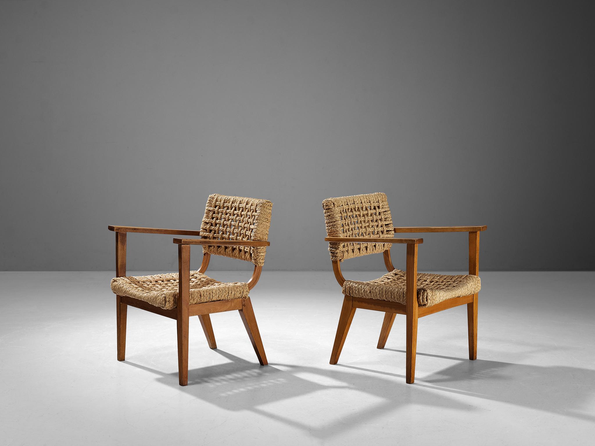 Adrien Audoux & Frida Minet for Vibo Vesoul, pair of armchairs, beech, straw, France, 1950s. 

Pair of armchairs designed by the duo Adrien Audoux and Frida Minet. The seating and backrest are made of woven hemp from the abaca plant which is close