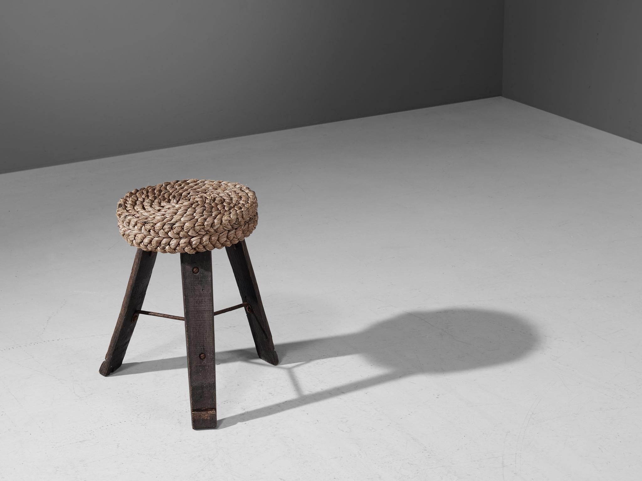 Adrien Audoux and Frida Minet, stool, oak, straw, France, 1950s.

This item was created by the French designer couple Adrien Audoux and Frida Minet. The three flat legs of the stool are made of dark oak. The wood was originally used for wine